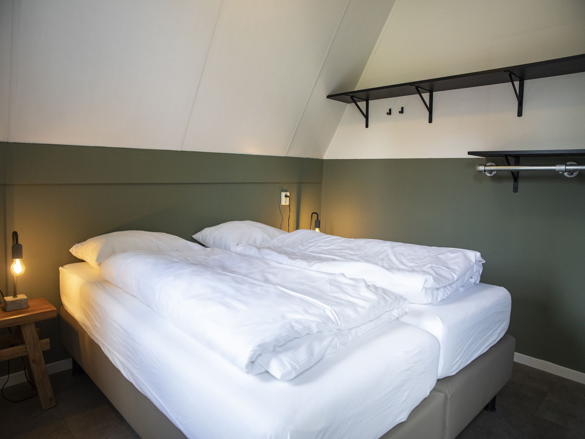 Een slaapkamer van Vakantie bij Meeussen - Molendal 2 in Plasmolen