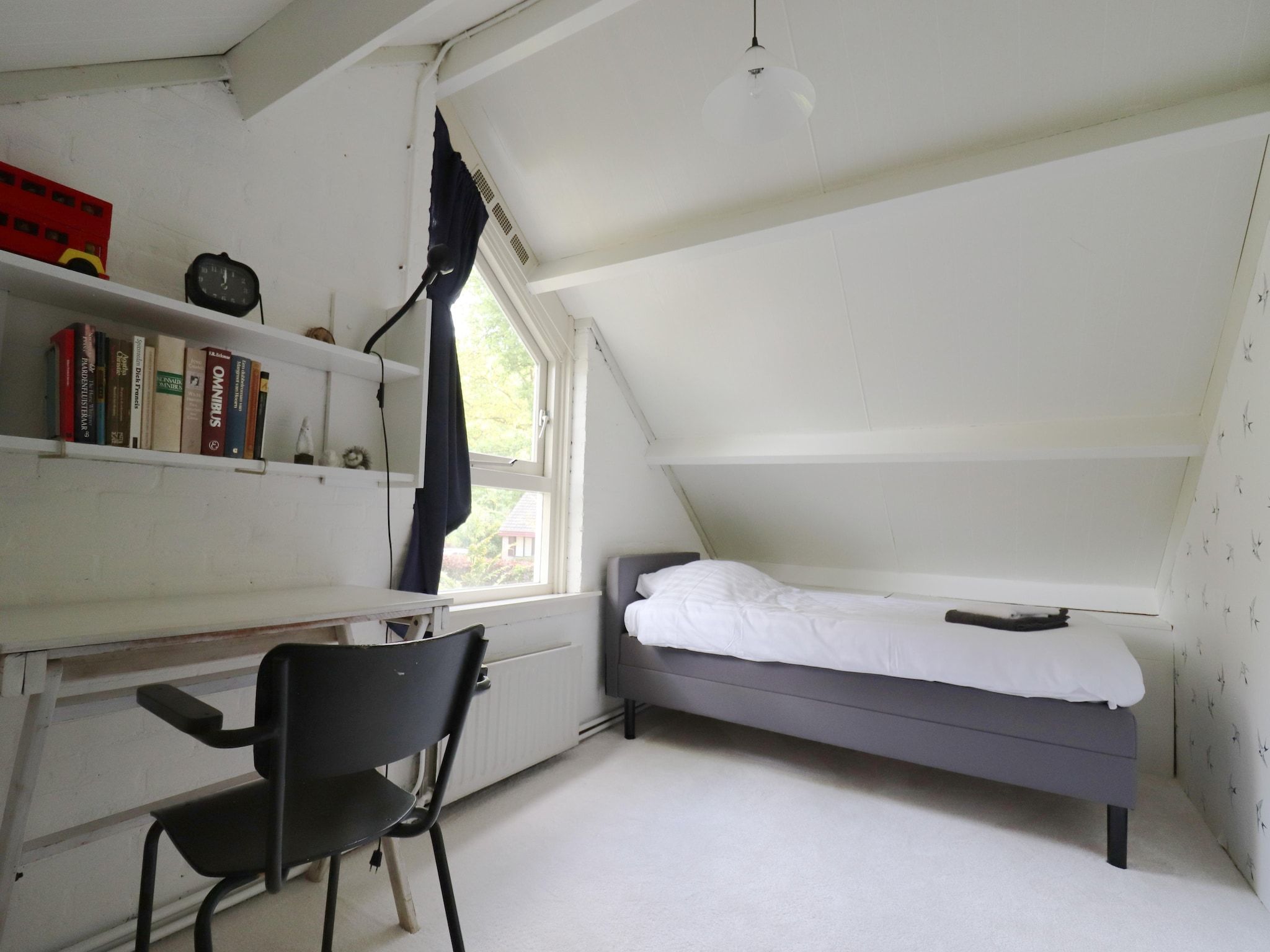 Een slaapkamer van Boshuisje De Koolmees in Appelscha