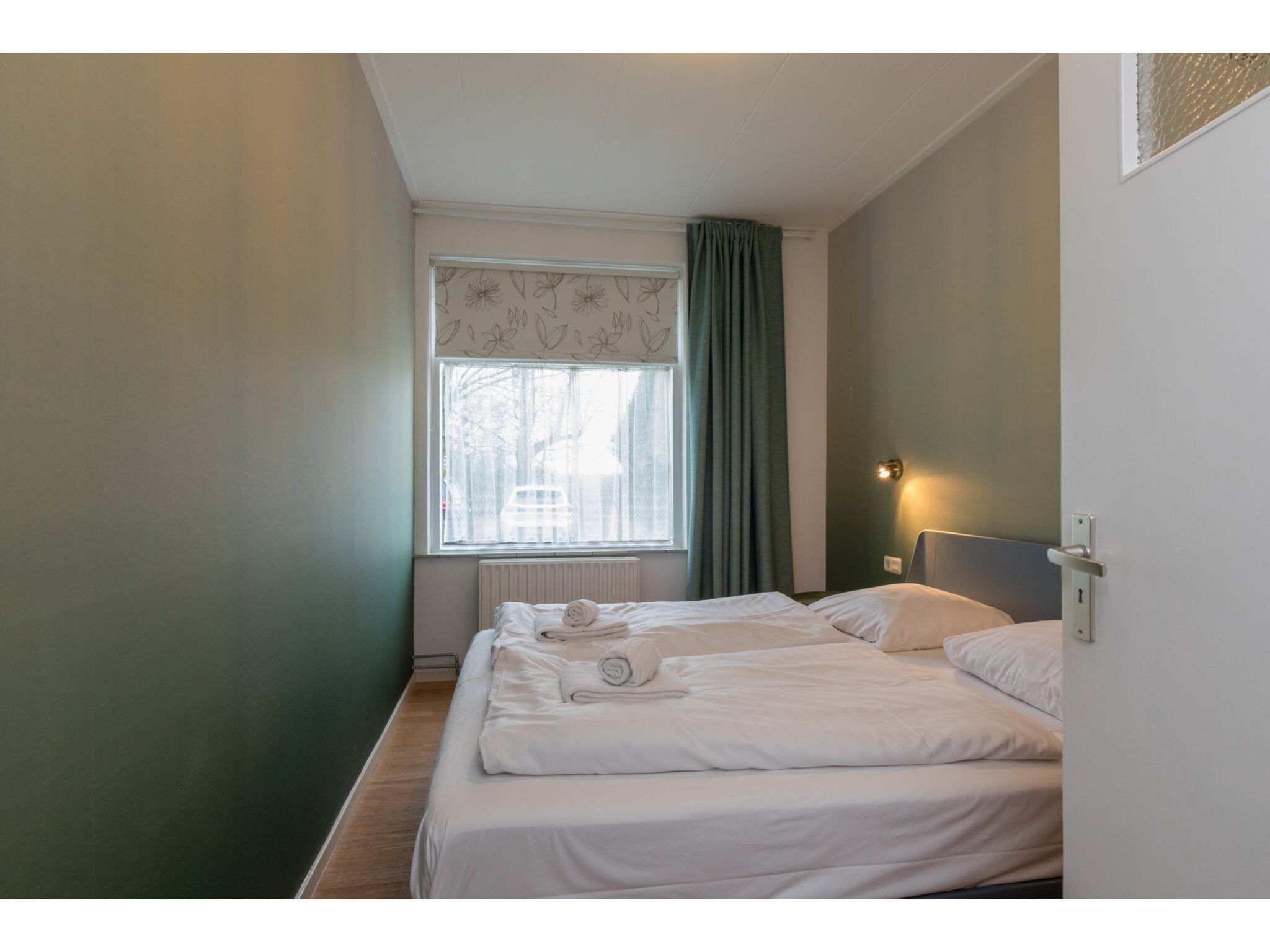 Een slaapkamer van Appartement - Kon Emmaweg 6  beneden app in Vrouwenpolder