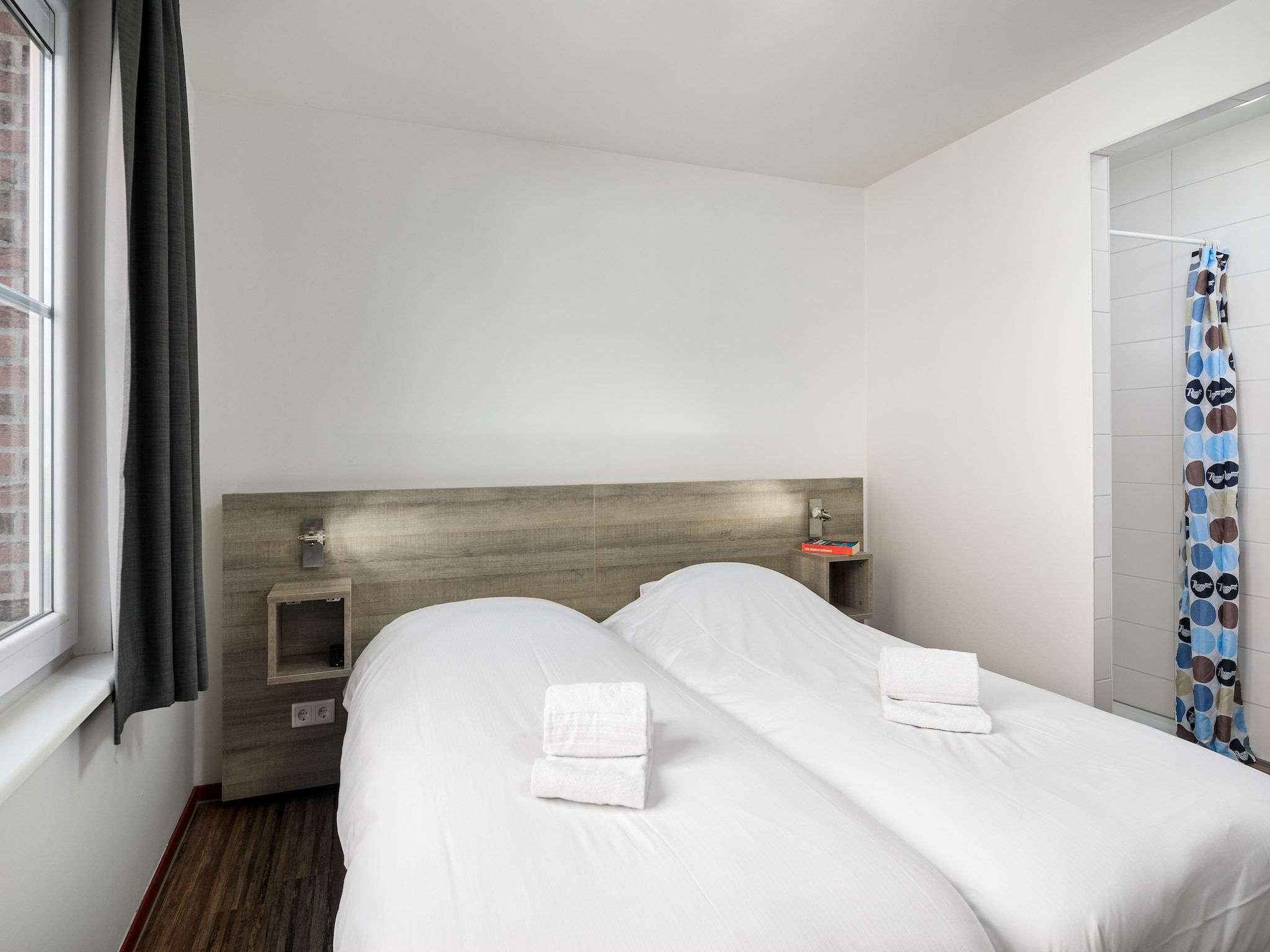 Een slaapkamer van Vakantiepark Klein Vink 9 in Arcen