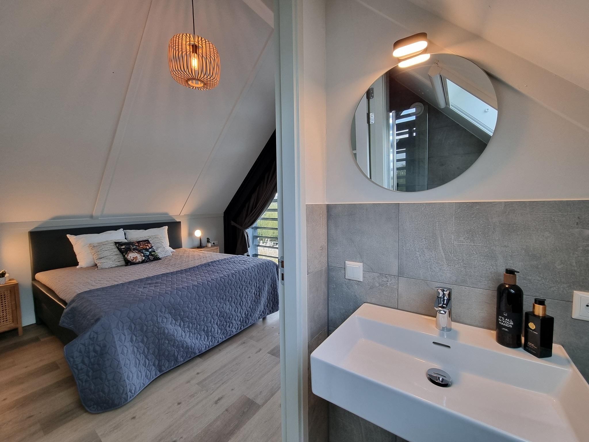 Een slaapkamer van Watervilla Twa in Balk
