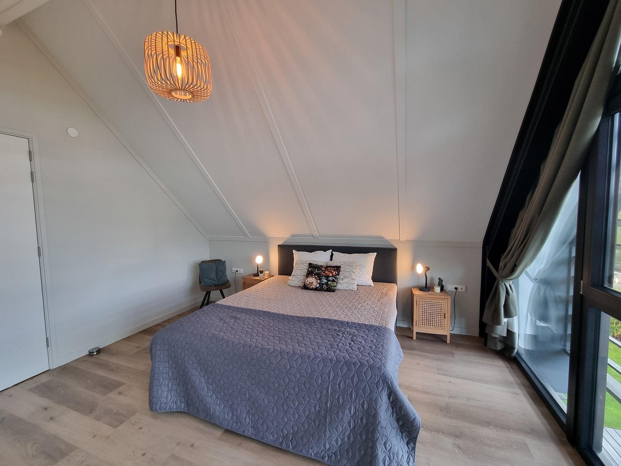 Een slaapkamer van Watervilla Twa in Balk