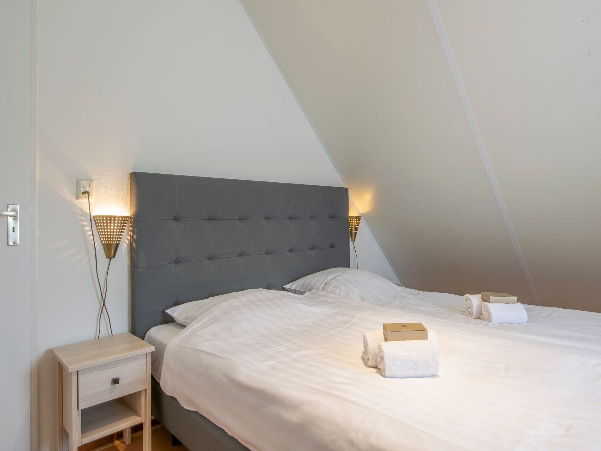 Een slaapkamer van Vakantiepark Zeeland Village 3 in Scharendijke