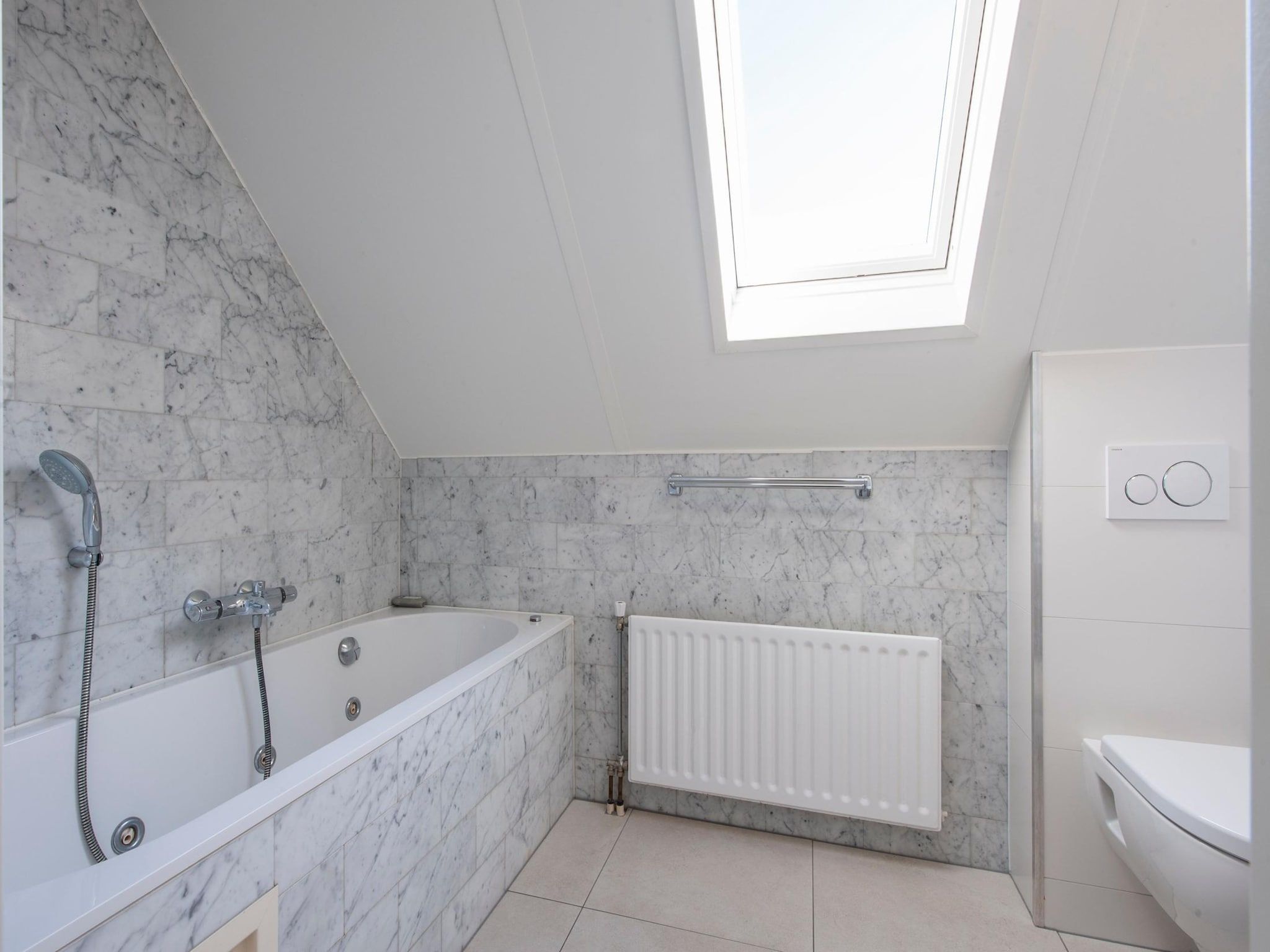 De badkamer van Vakantiepark Zeeland Village 4 in Scharendijke