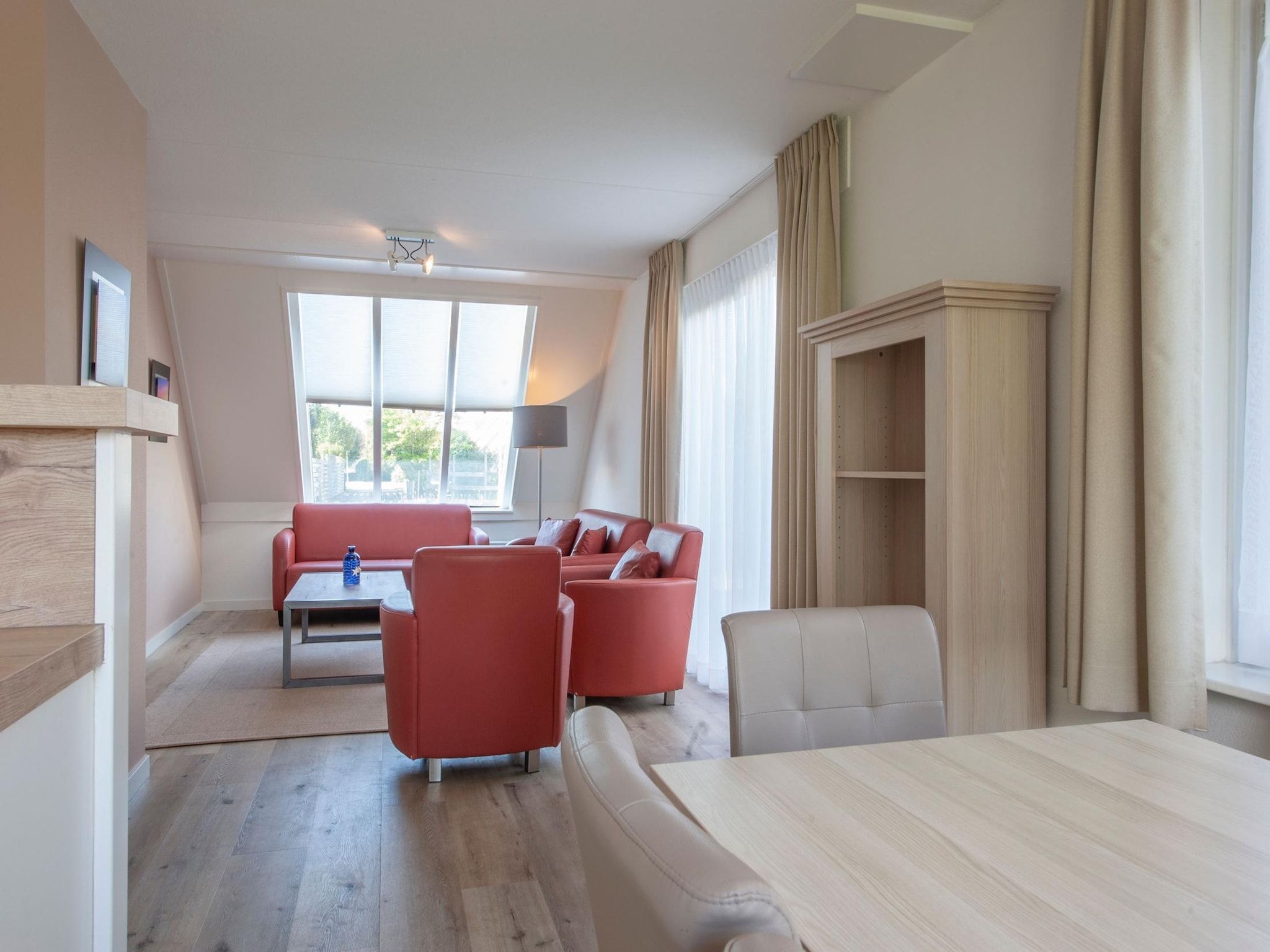 De woonkamer van Vakantiepark Zeeland Village 4 in Scharendijke