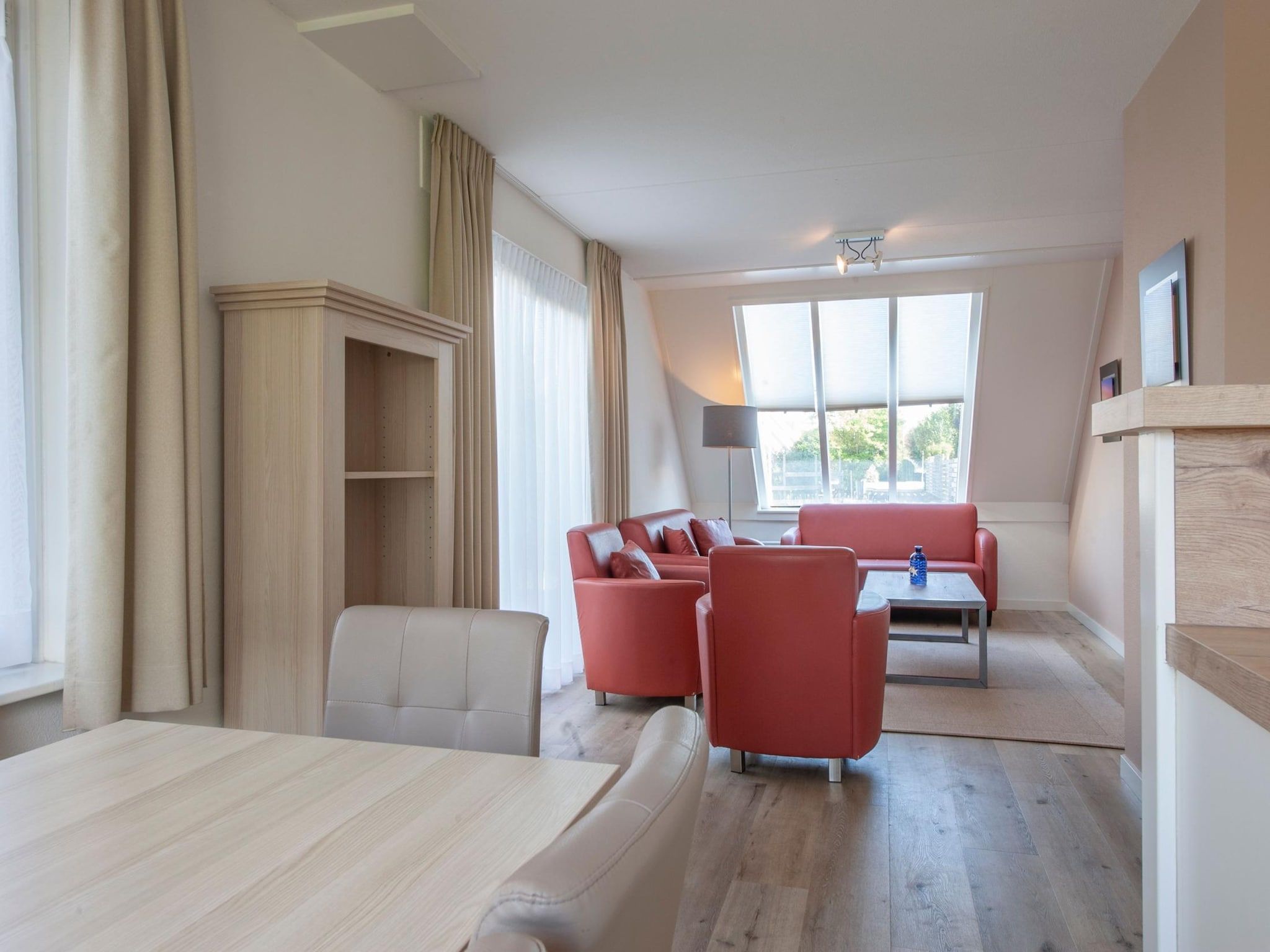 De woonkamer van Vakantiepark Zeeland Village 4 in Scharendijke