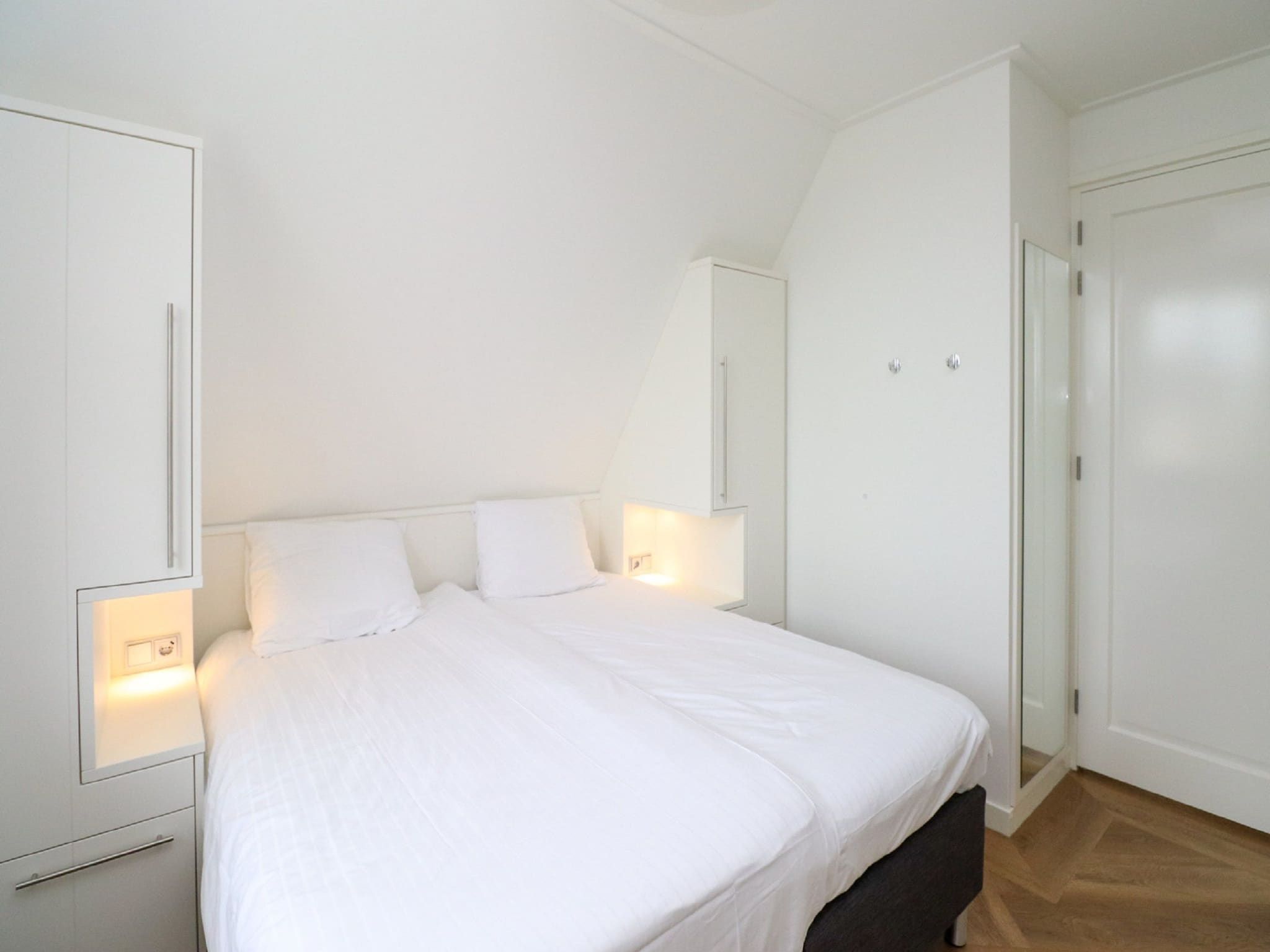 Een slaapkamer van Friese Meren Villa's 16 in Delfstrahuizen