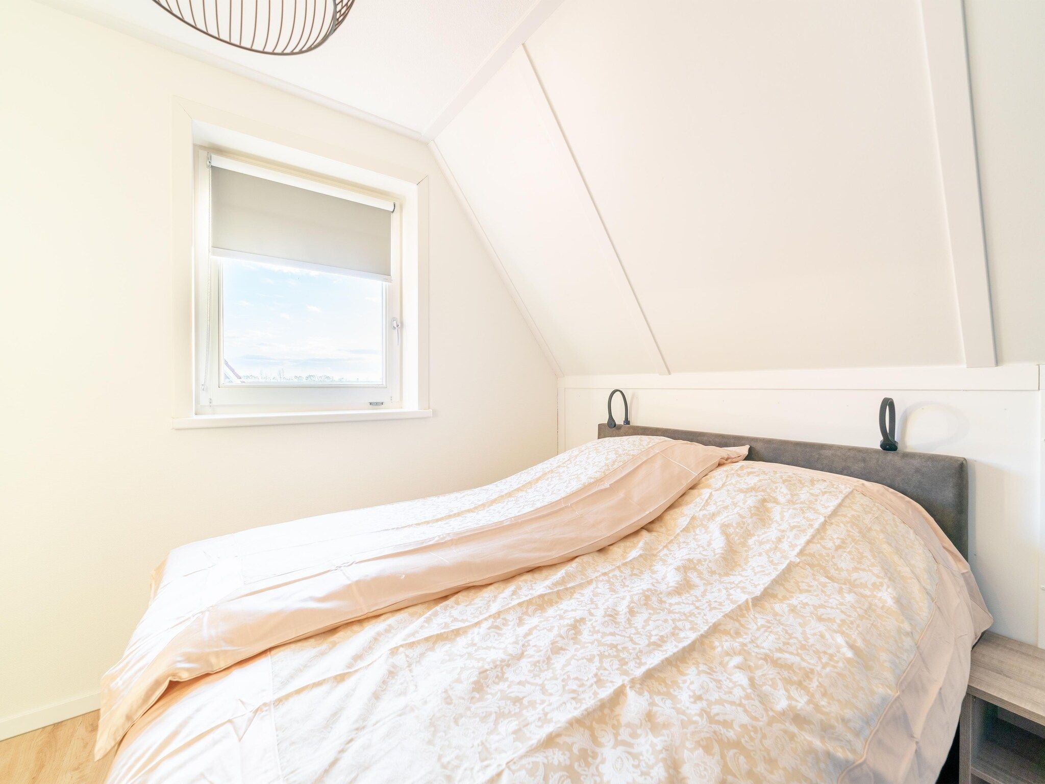 Een slaapkamer van De Ooievaar Huis NR 23 in Scherpenisse