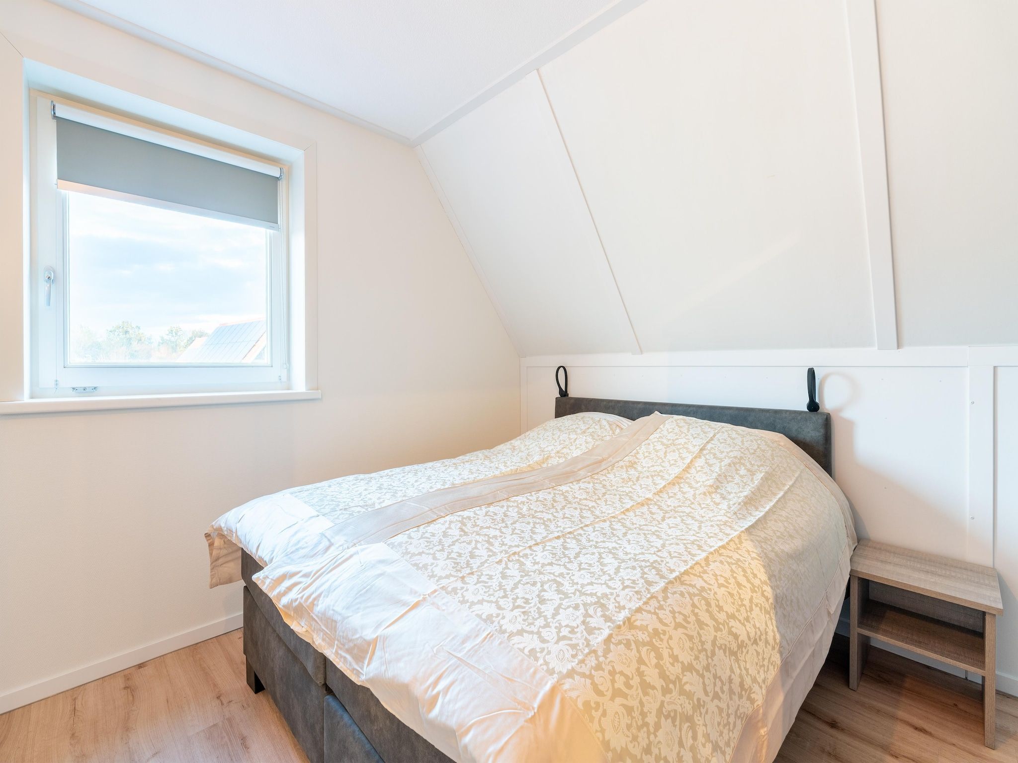 Een slaapkamer van De Ooievaar Huis NR 23 in Scherpenisse