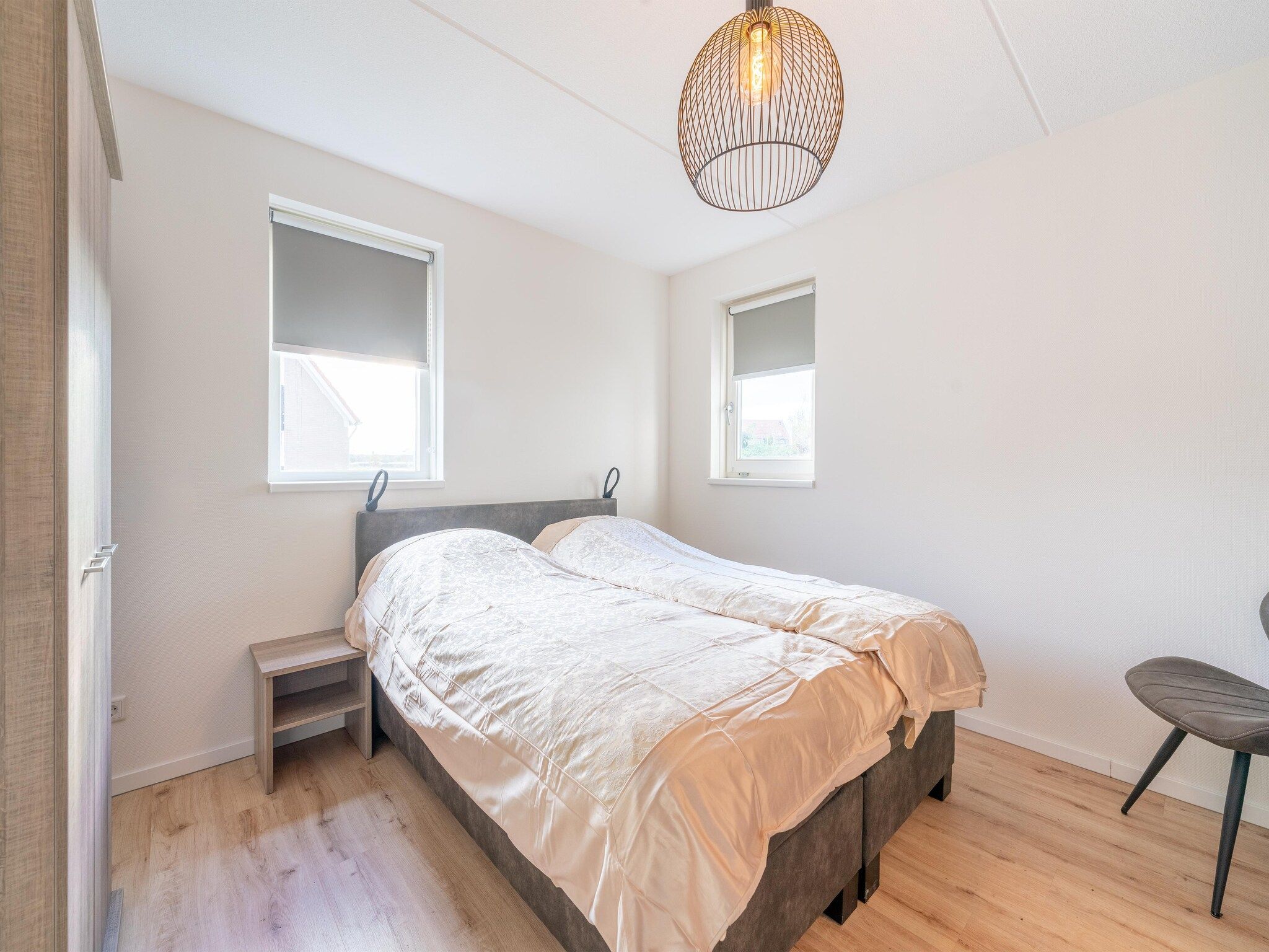 Een slaapkamer van De Ooievaar Huis NR 23 in Scherpenisse