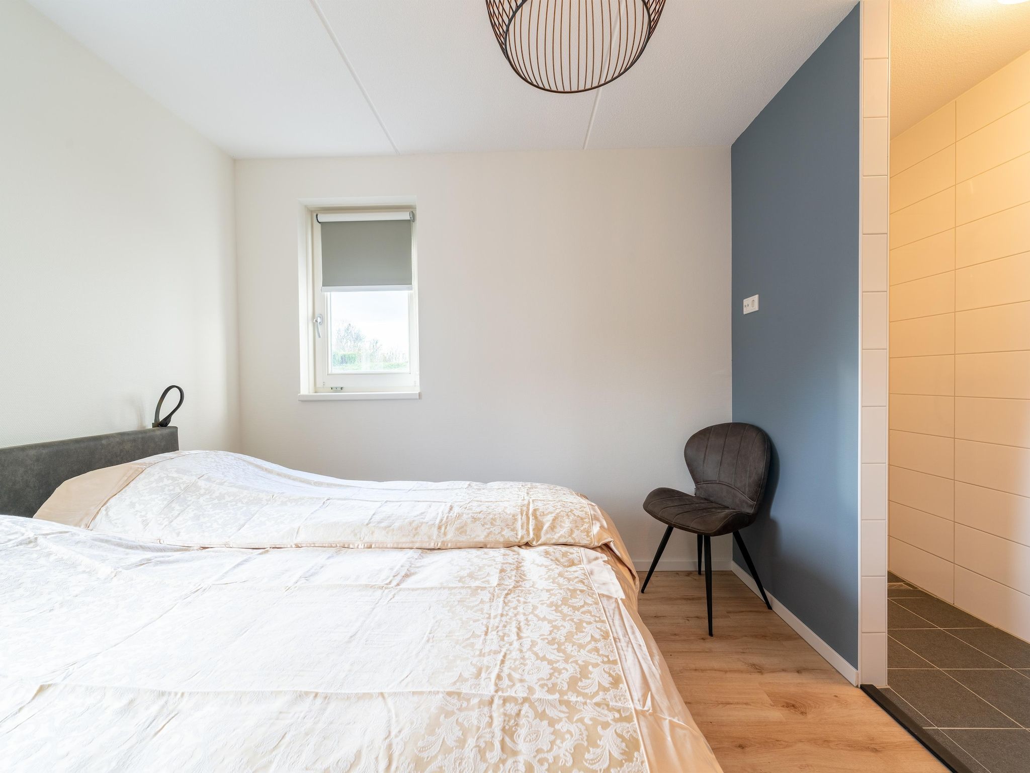 Een slaapkamer van De Ooievaar Huis NR 23 in Scherpenisse