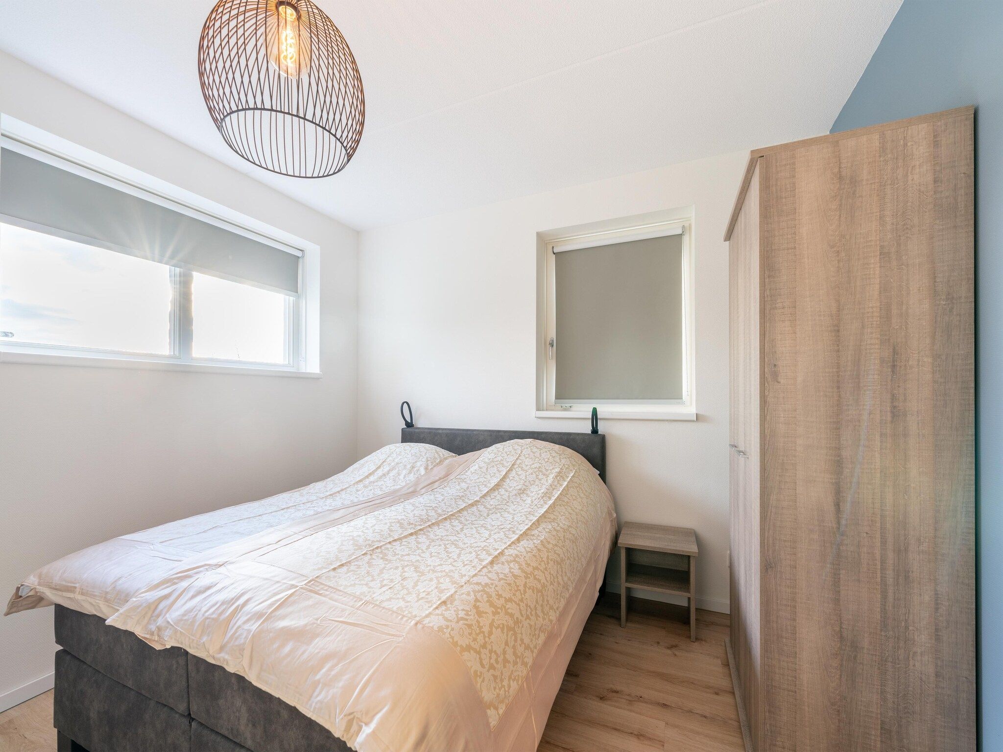 Een slaapkamer van De Ooievaar Huis NR 23 in Scherpenisse