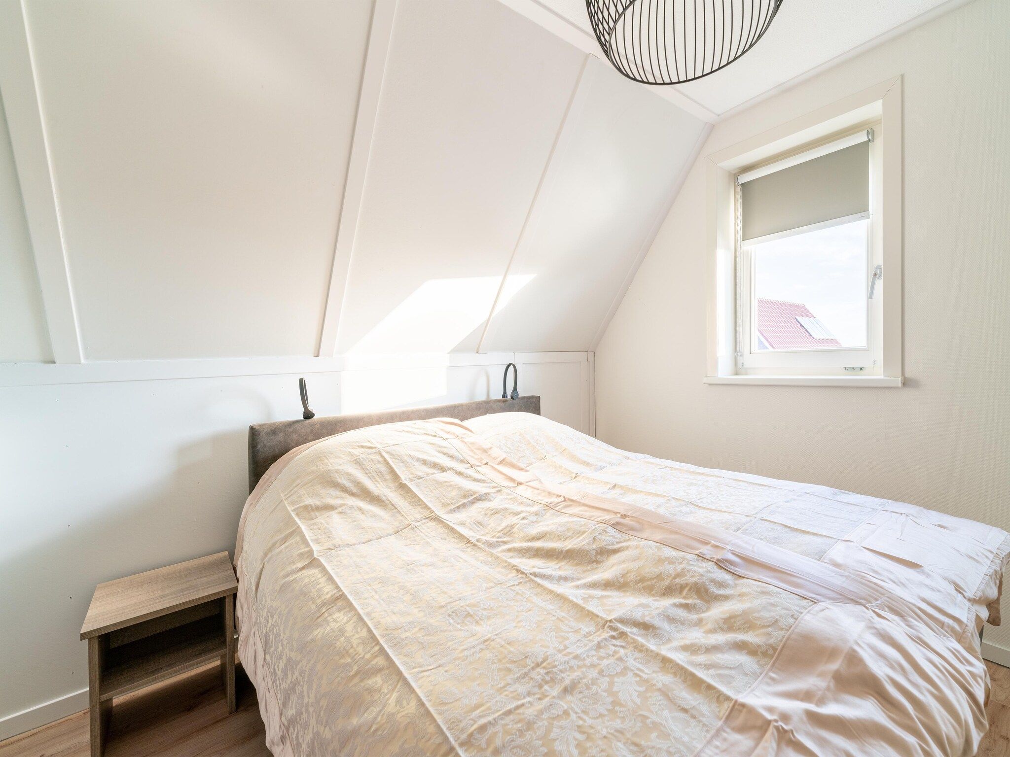 Een slaapkamer van De Ooievaar Huis NR 23 in Scherpenisse