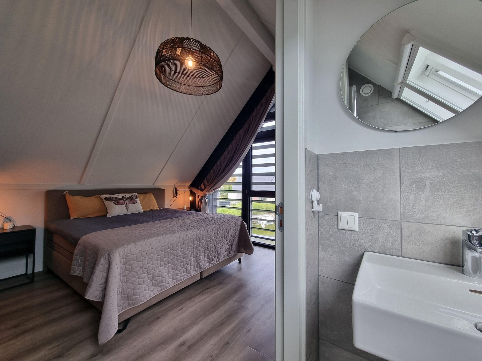 Een slaapkamer van Watervilla Tolve in Balk