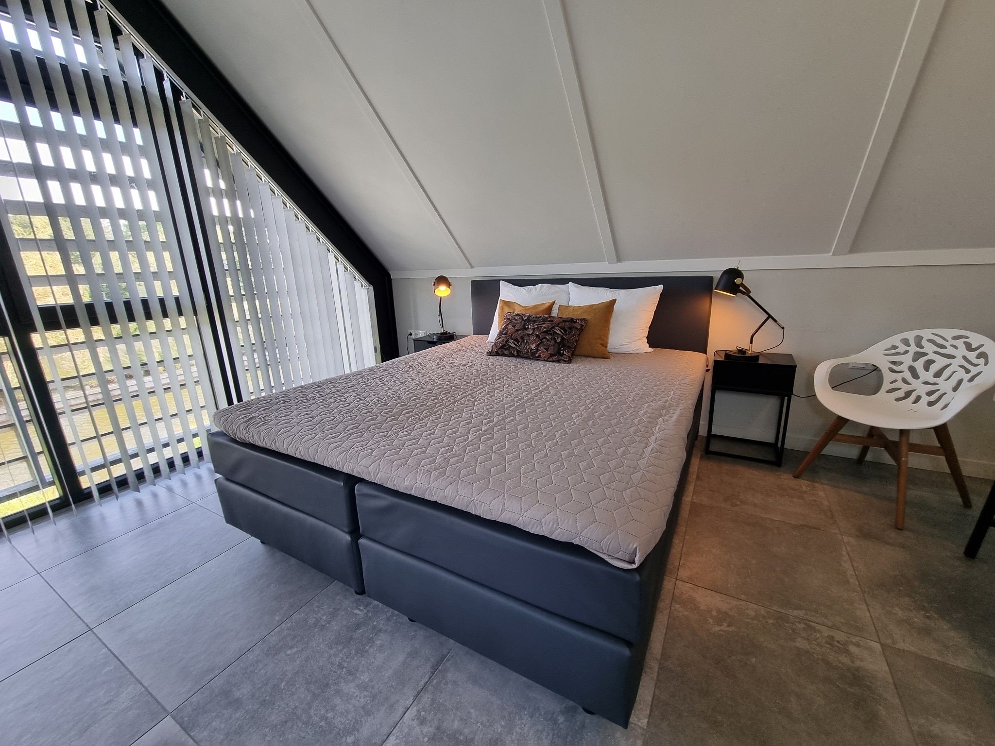 Een slaapkamer van Watervilla Fjirtjin in Balk