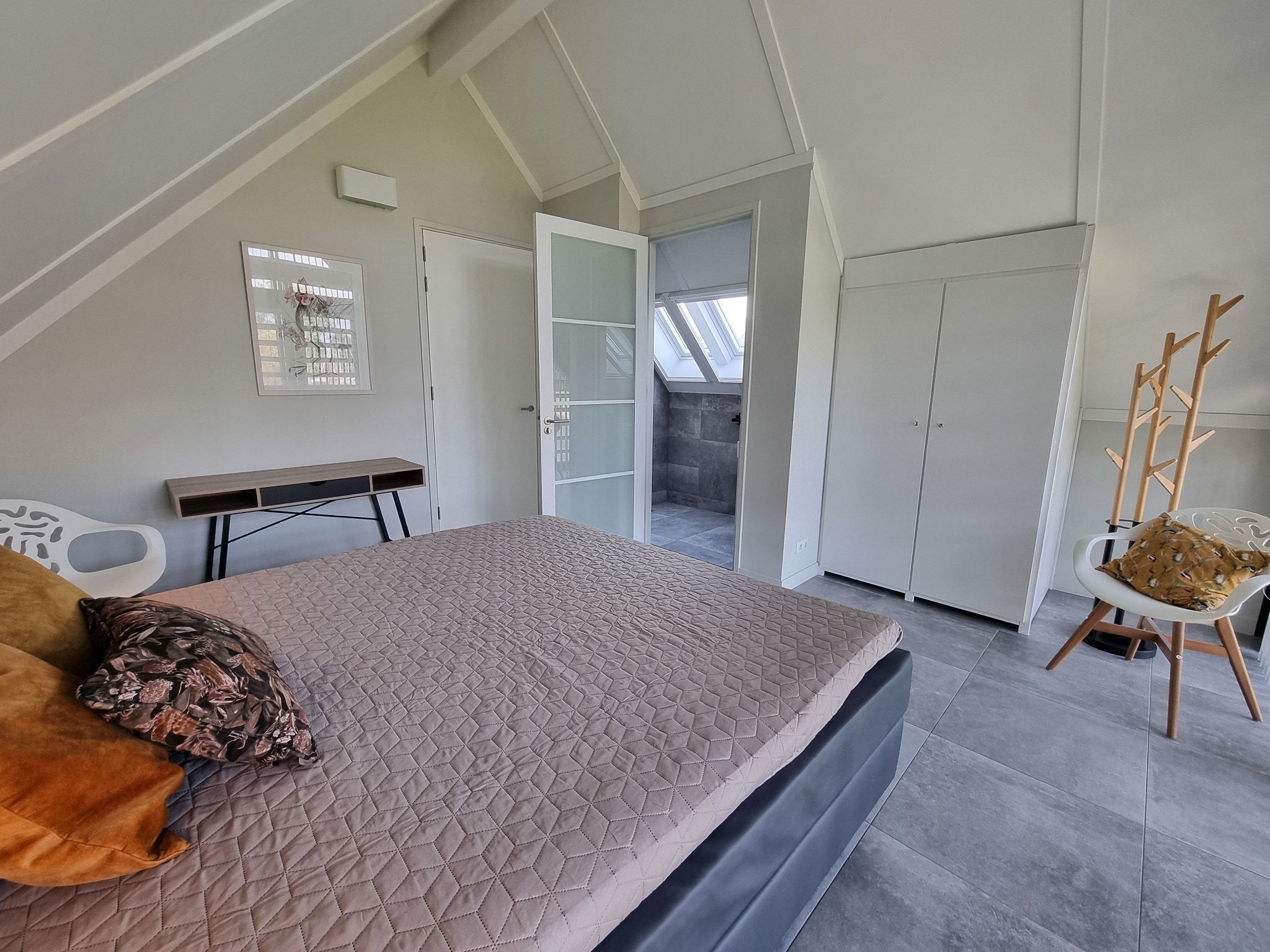 Een slaapkamer van Watervilla Fjirtjin in Balk