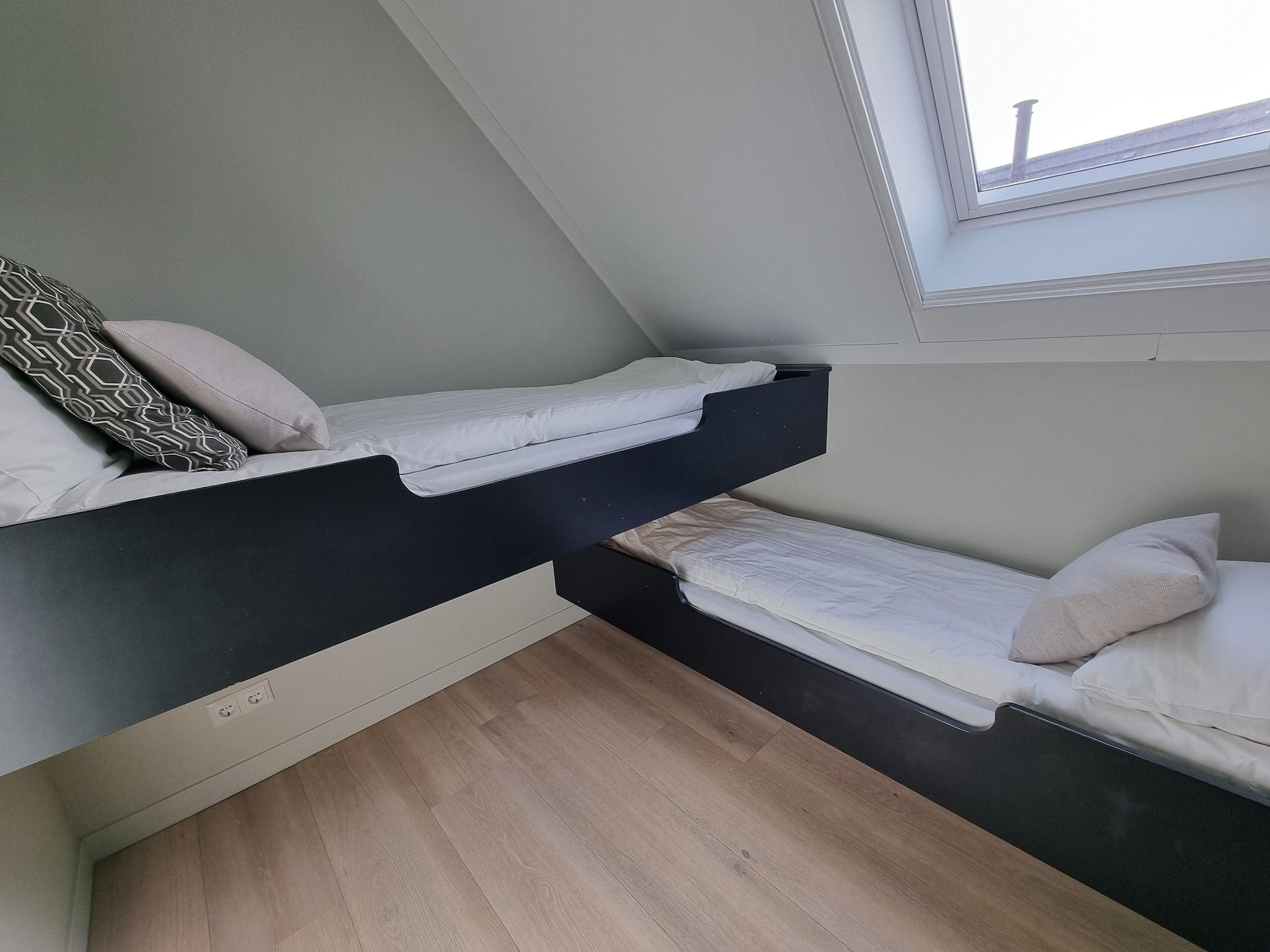 Een slaapkamer van Watervilla Santjin in Balk