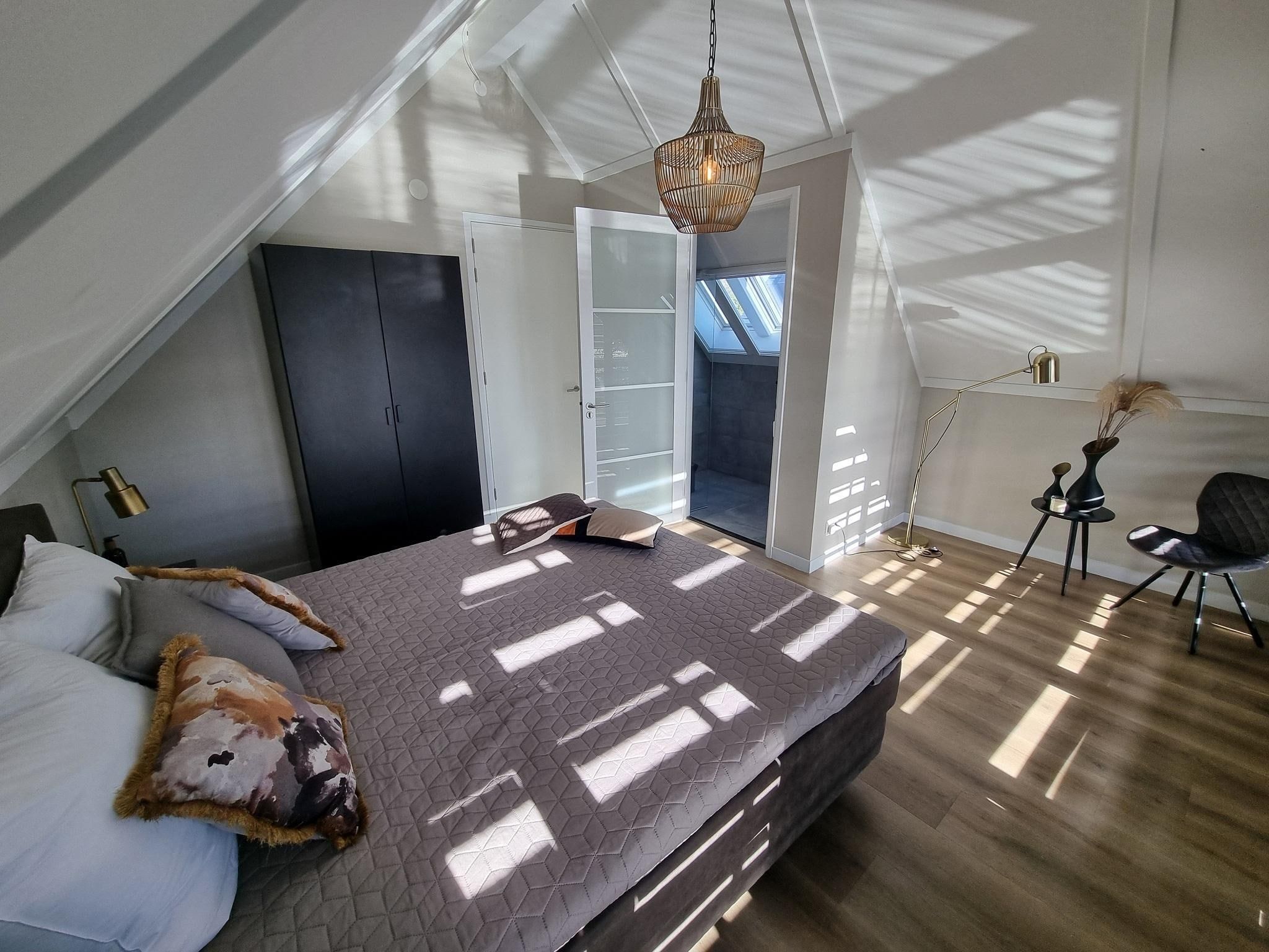 Een slaapkamer van Watervilla Achttjin in Balk