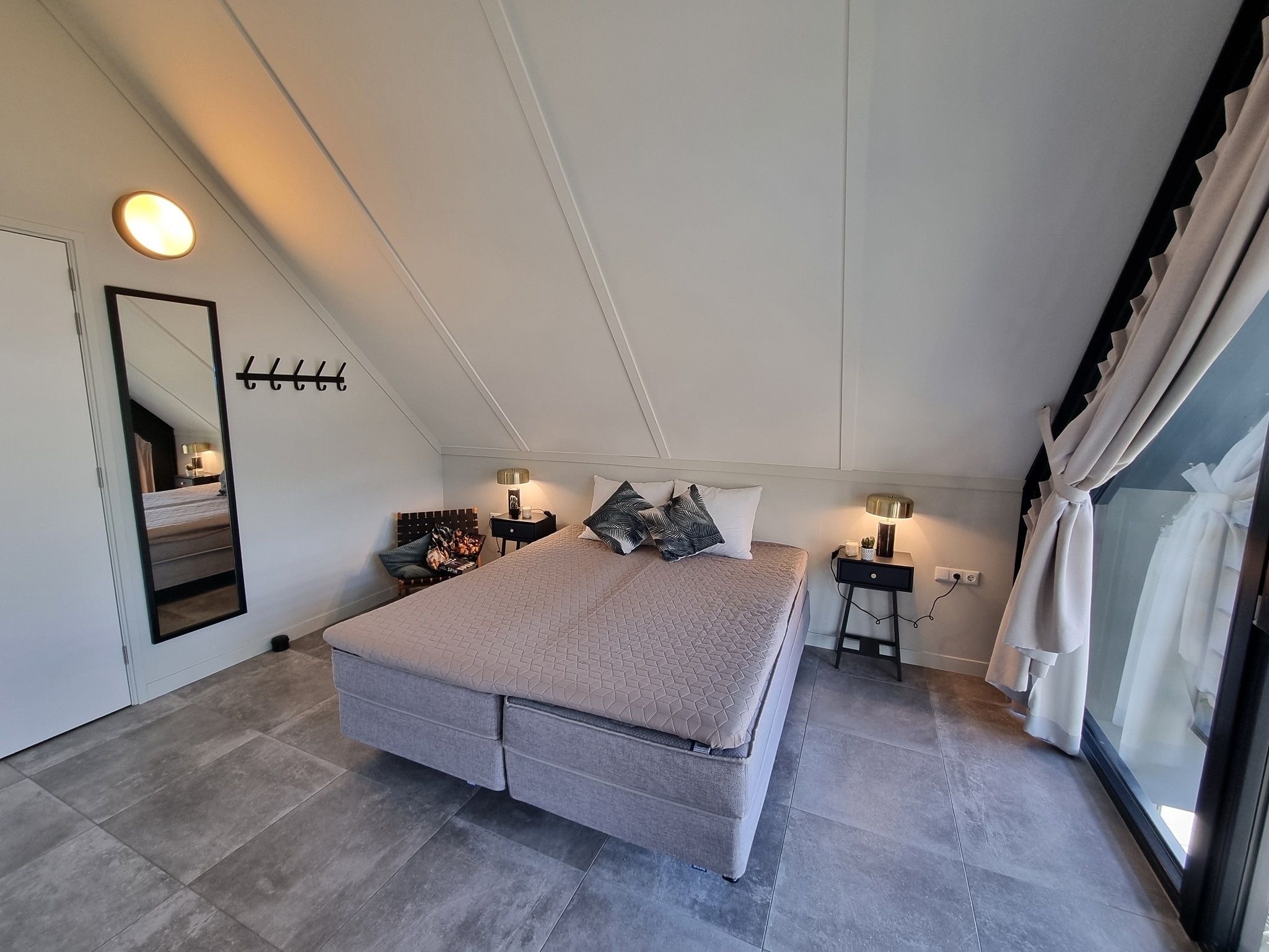 Een slaapkamer van Watervilla Ien in Balk