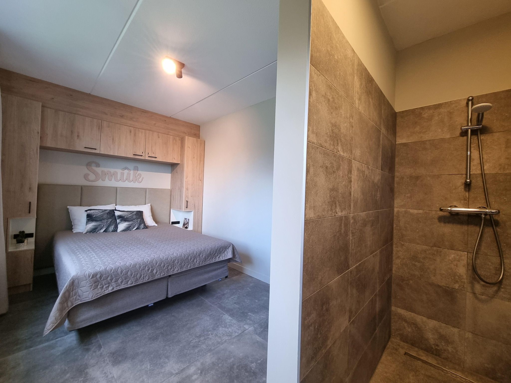 Een slaapkamer van Watervilla Ien in Balk