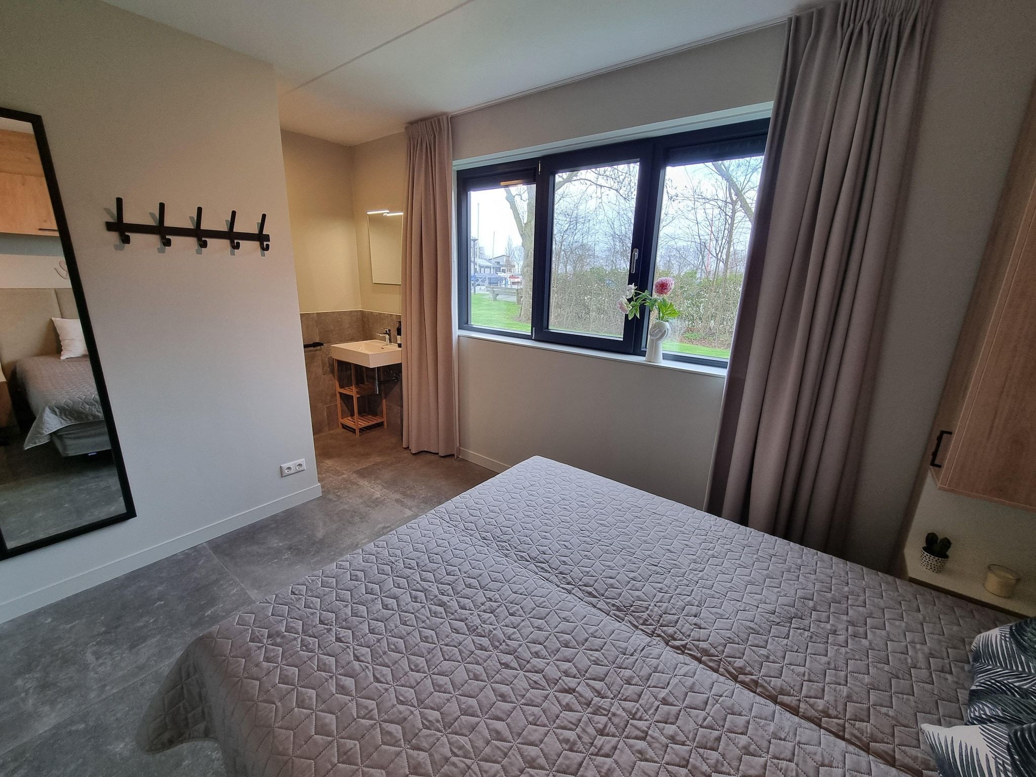 Een slaapkamer van Watervilla Ien in Balk