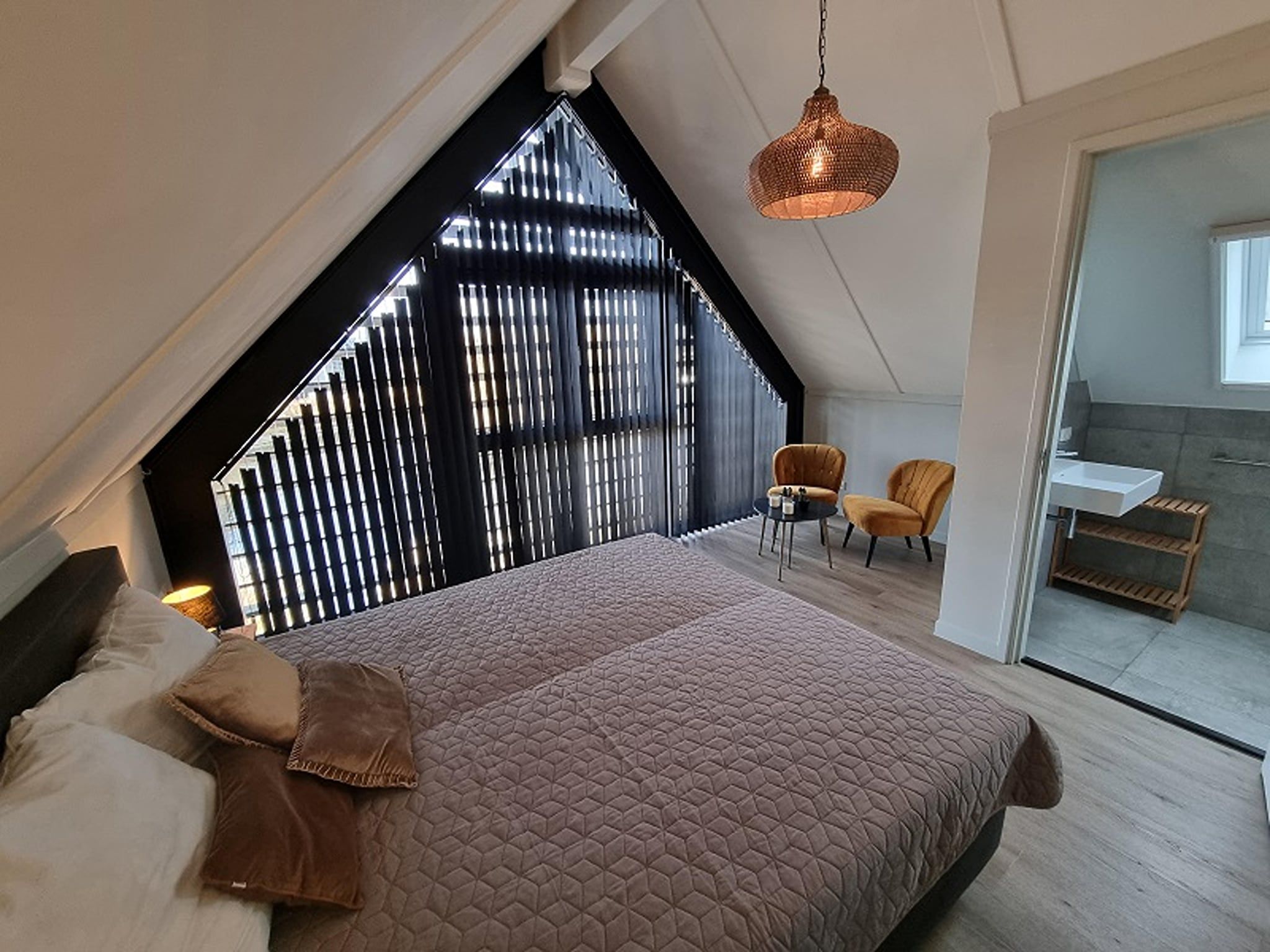 Een slaapkamer van Watervilla San in Balk