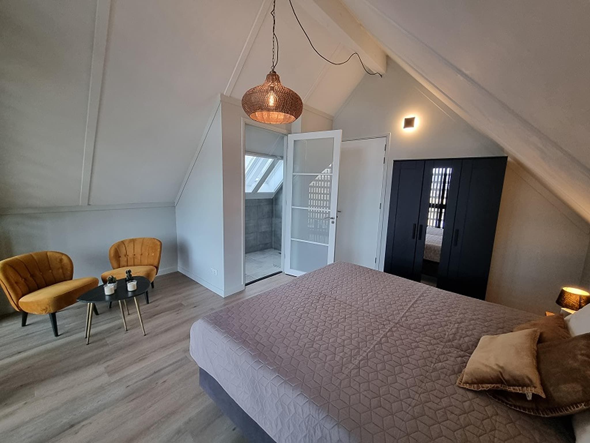 Een slaapkamer van Watervilla San in Balk