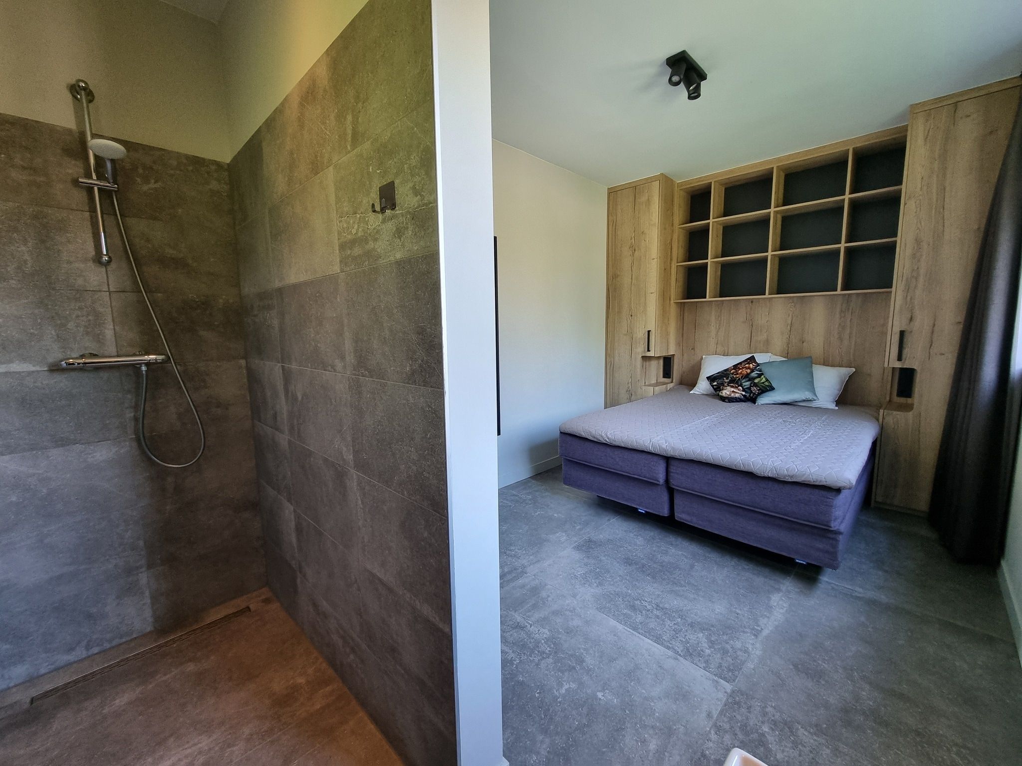 Een slaapkamer van Watervilla Tweintich in Balk