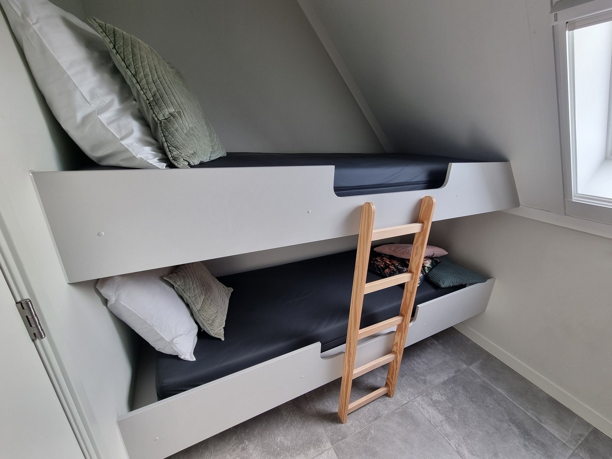 Een slaapkamer van Watervilla Tsien in Balk