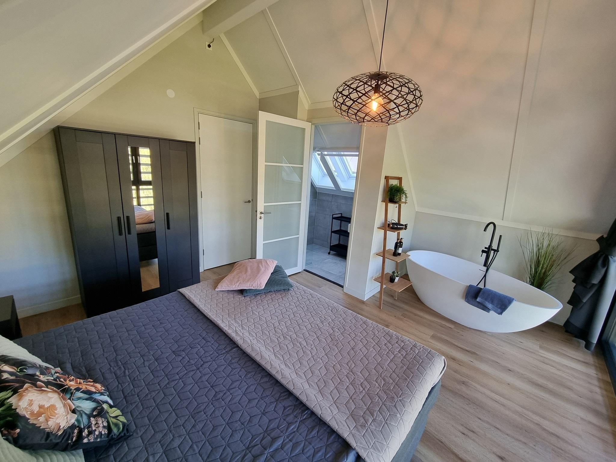 Een slaapkamer van Watervilla Alve in Balk