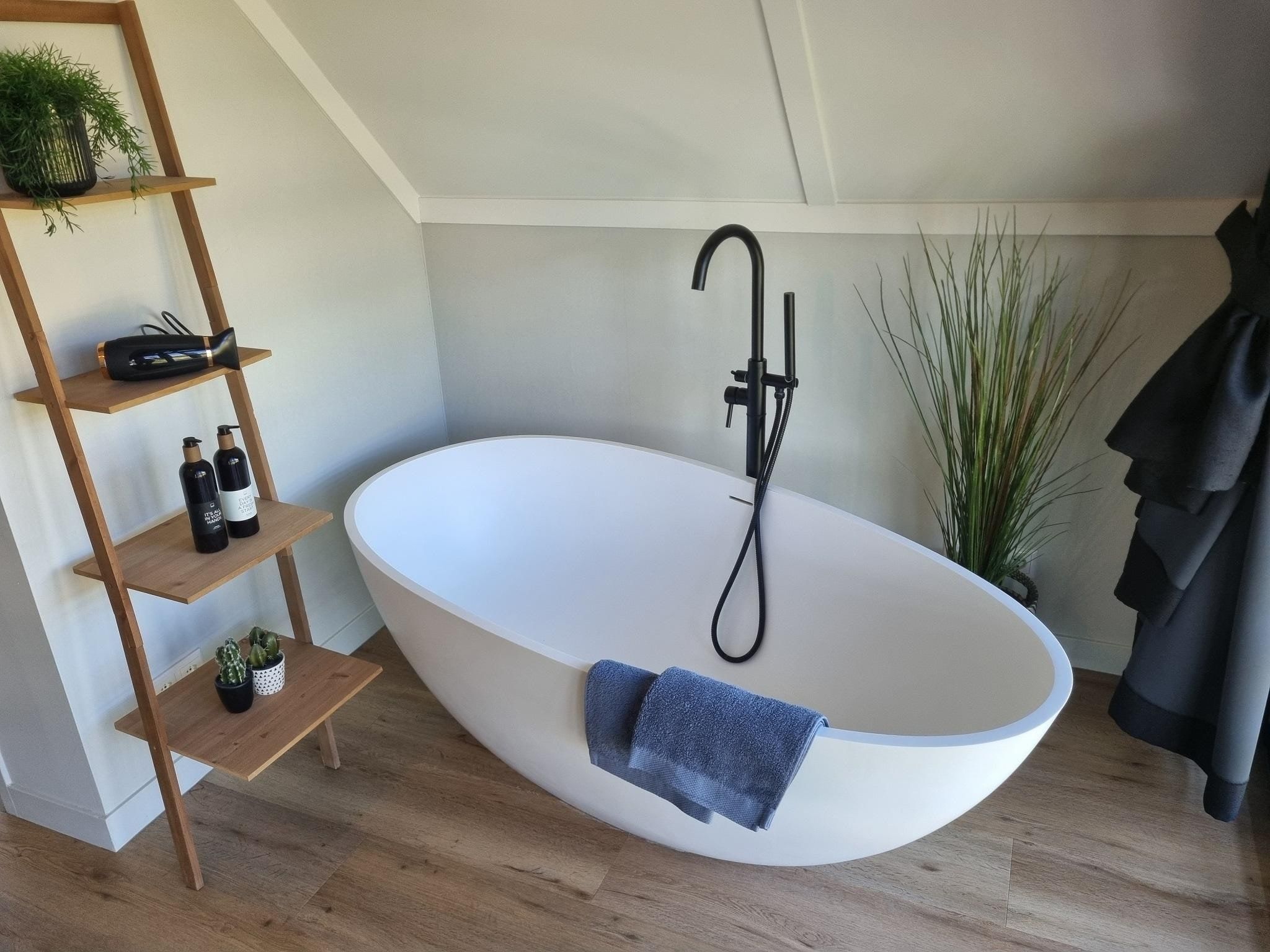 Een slaapkamer van Watervilla Alve in Balk