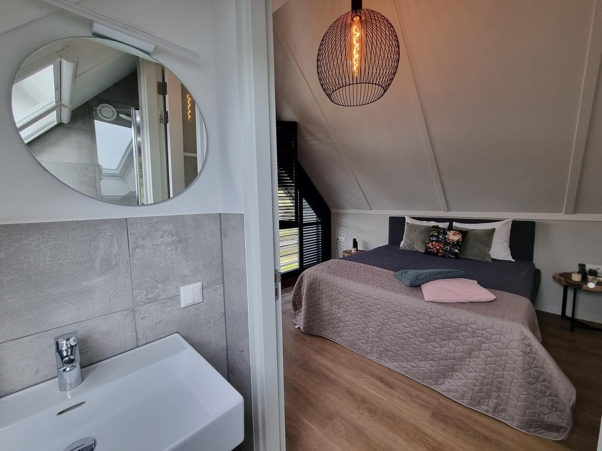 Een slaapkamer van Watervilla Trettjin in Balk