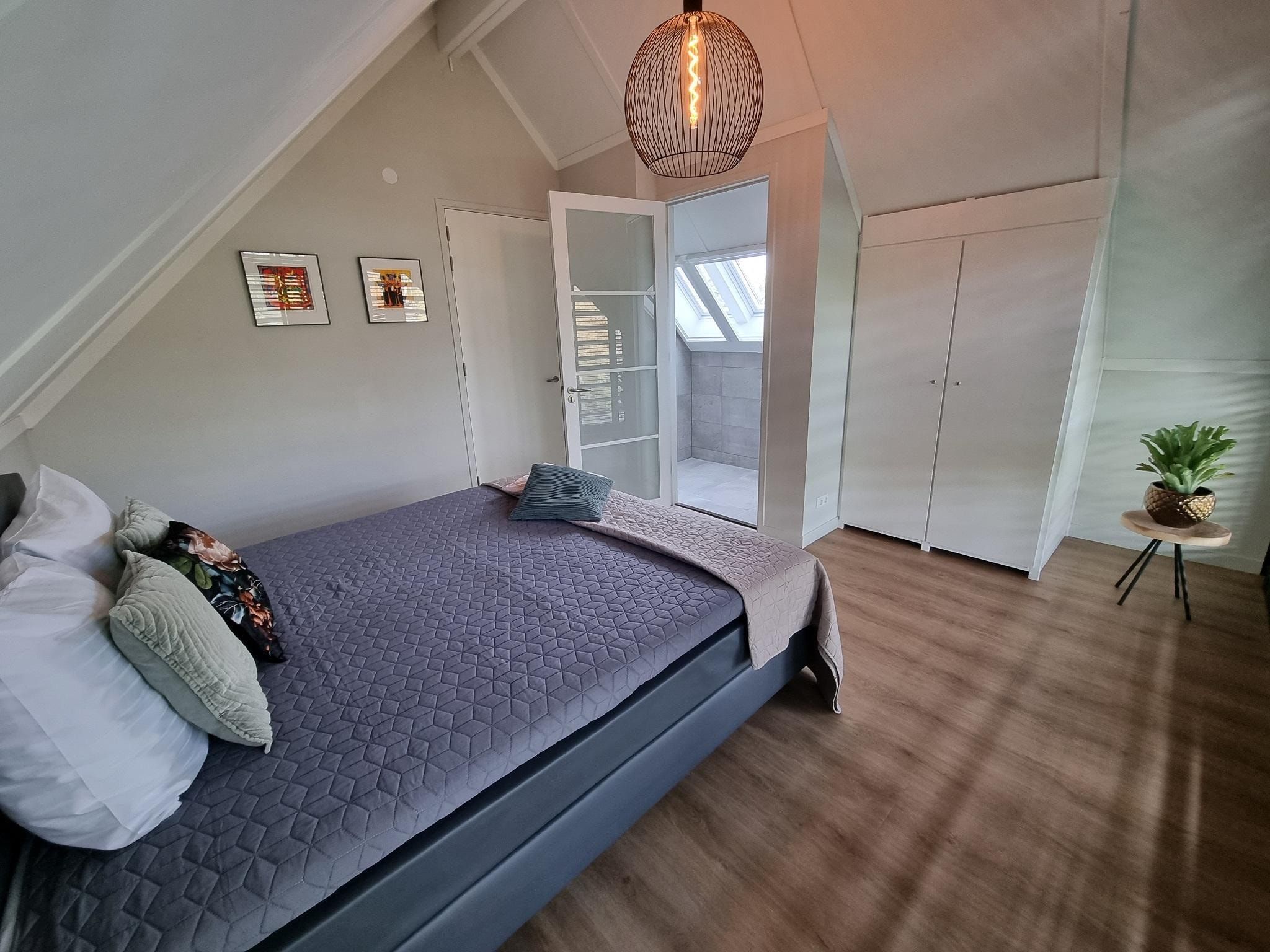 Een slaapkamer van Watervilla Trettjin in Balk