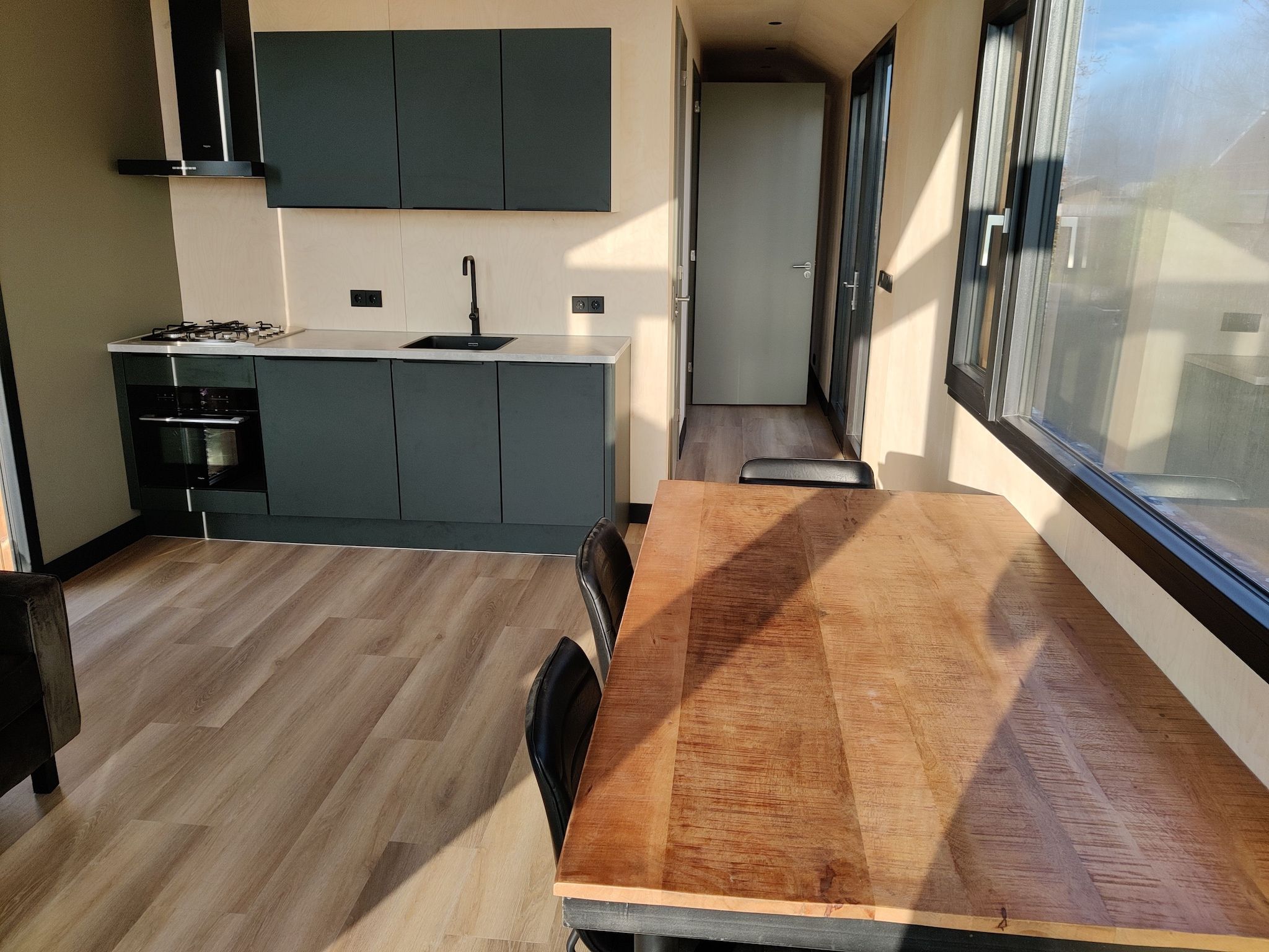 De woonkamer van Vakantiepark Eigen Wijze 11 in Bant