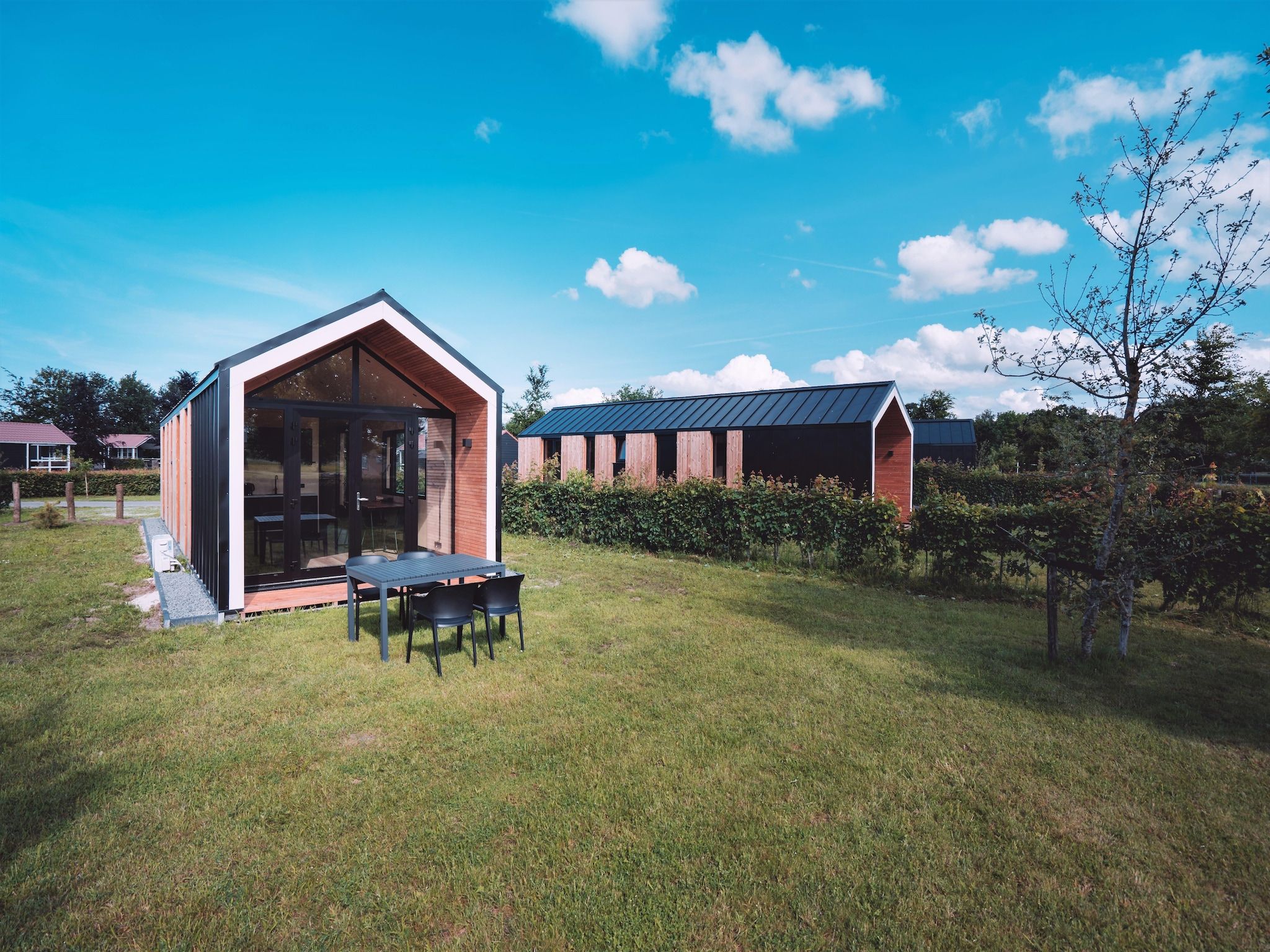 De tuin van Vakantiepark Eigen Wijze 11 in Bant