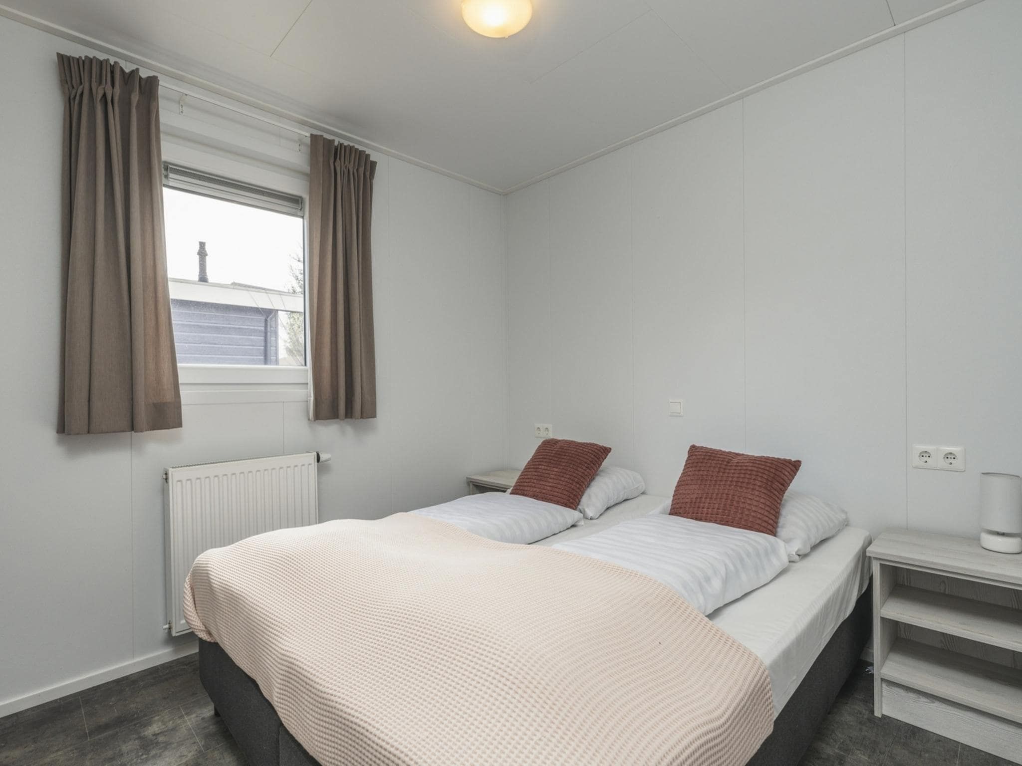 Een slaapkamer van Vakantiepark Mölke 30 in Zuna