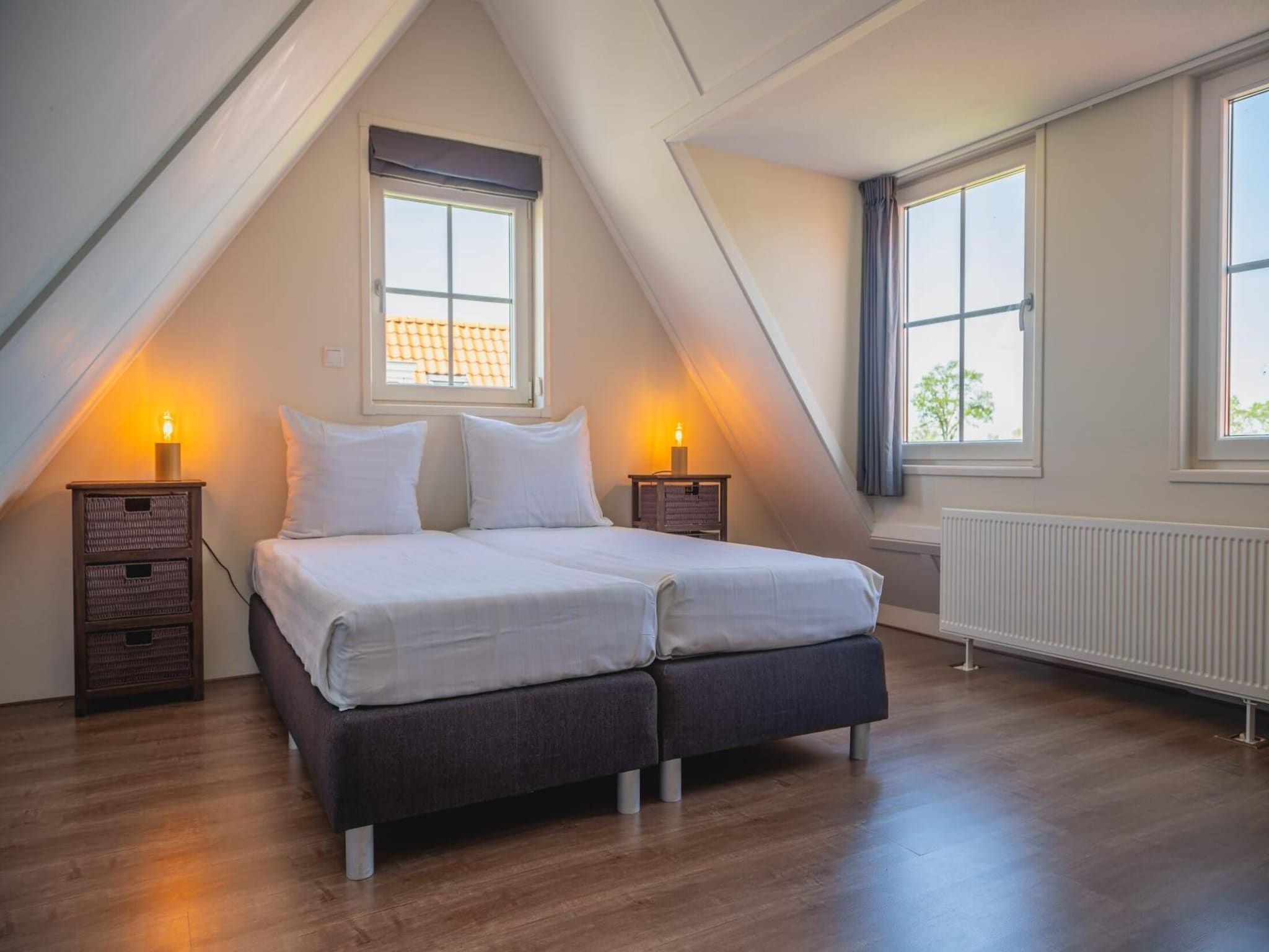 Een slaapkamer van 	De Rijp met Sauna  6 personen in West-Graftdijk
