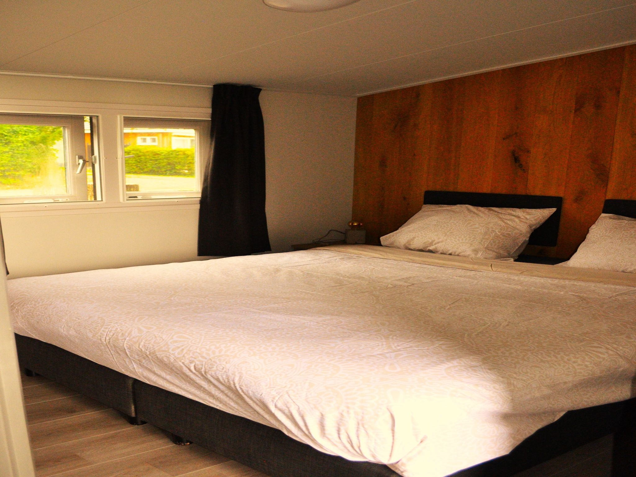 Een slaapkamer van Chalet Vrijzicht in Haulerwijk