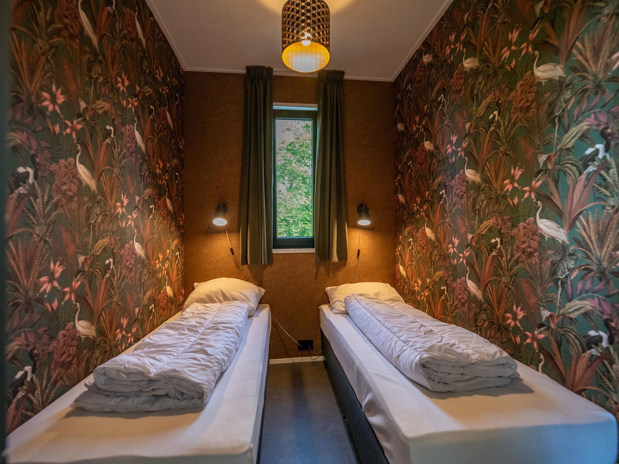 Een slaapkamer van Wellnesslodge Scholekster 4p in Dalerveen