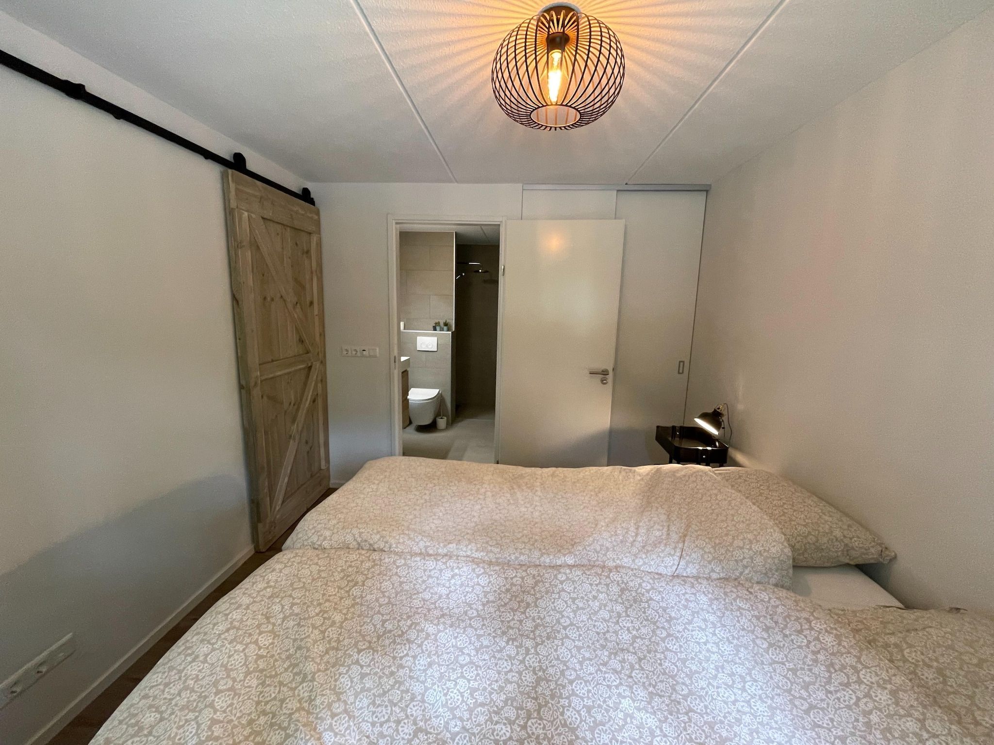 Een slaapkamer van Energievriendelijk 't Brummelhuus H556 in Lochem