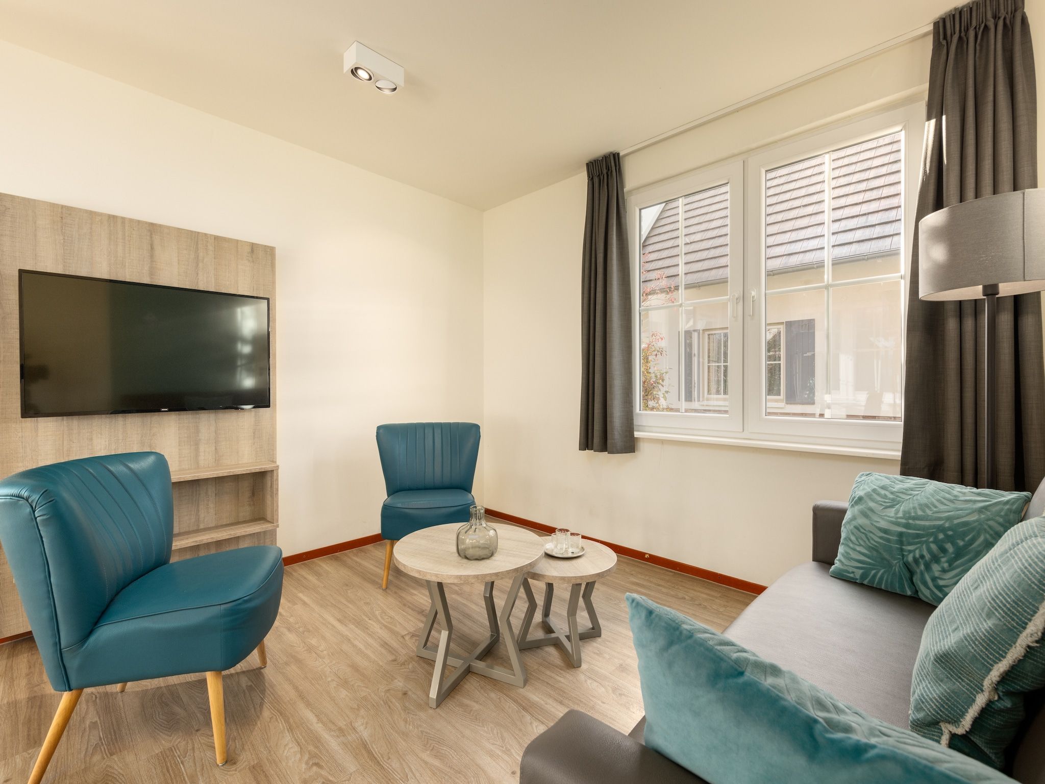 De woonkamer van Vakantiepark Klein Vink 10 in Arcen