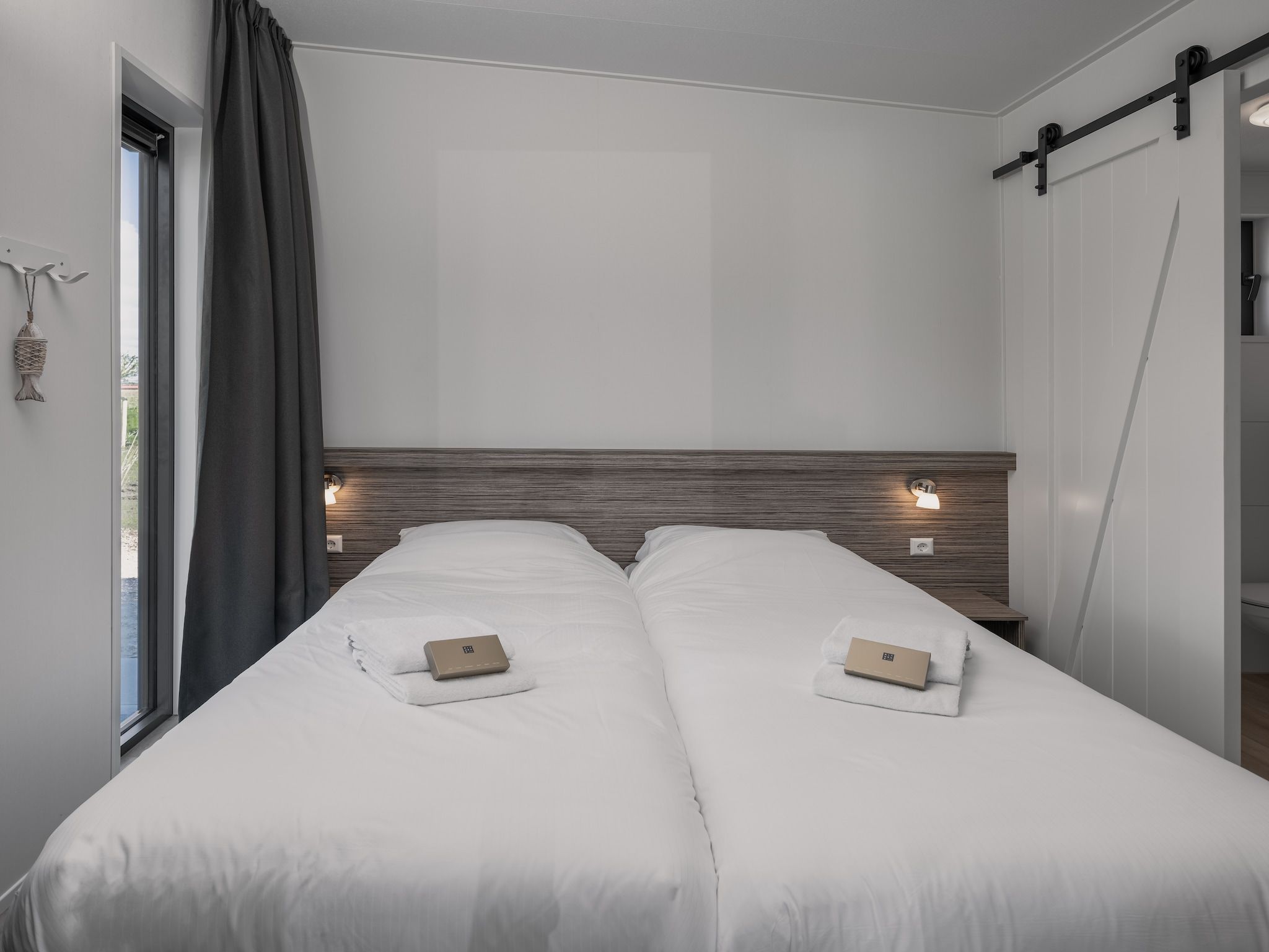 Een slaapkamer van Park Wijdenes 4 in Wijdenes