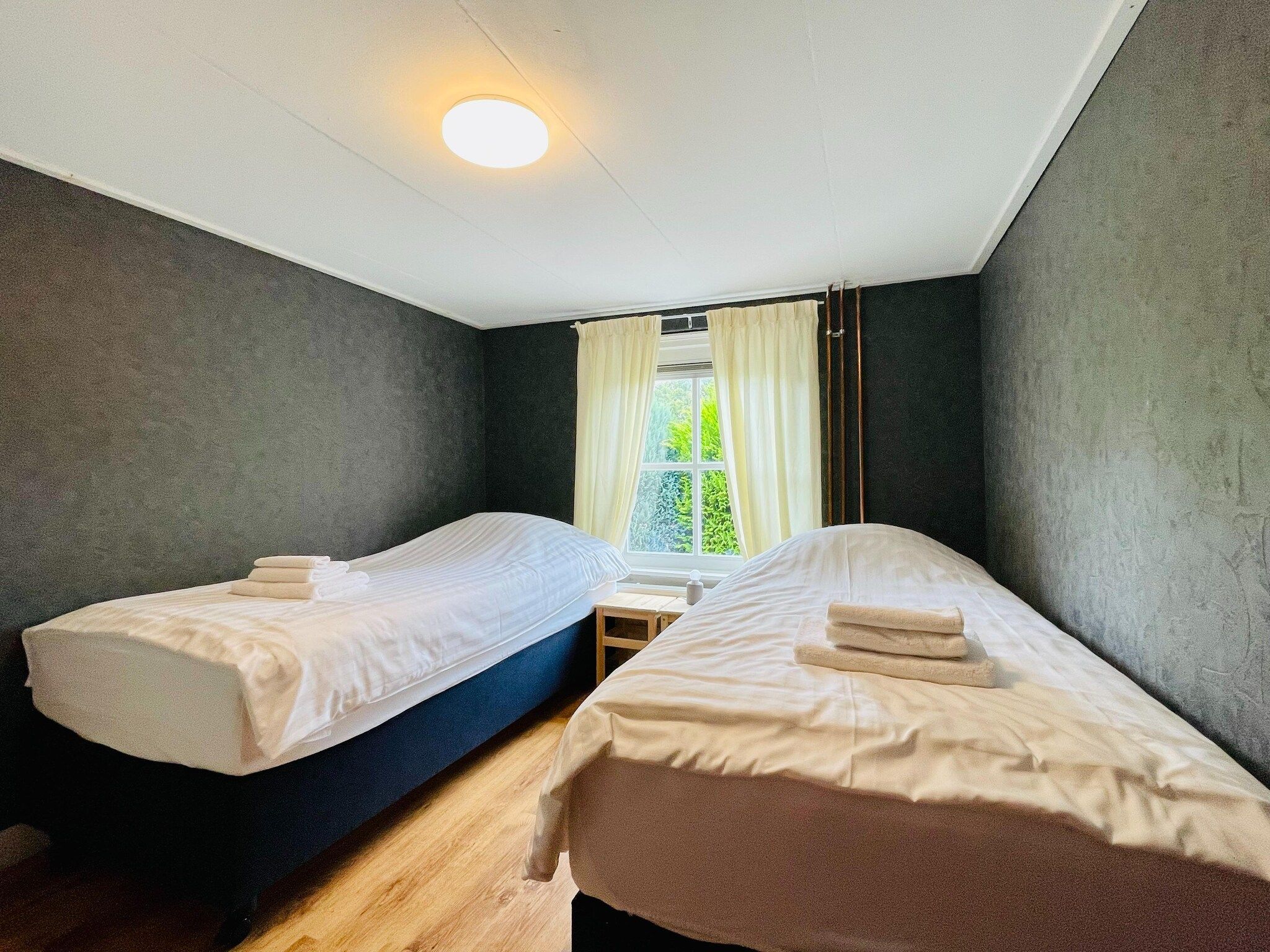 Een slaapkamer van Welskerveen - 4 personen in De Heurne