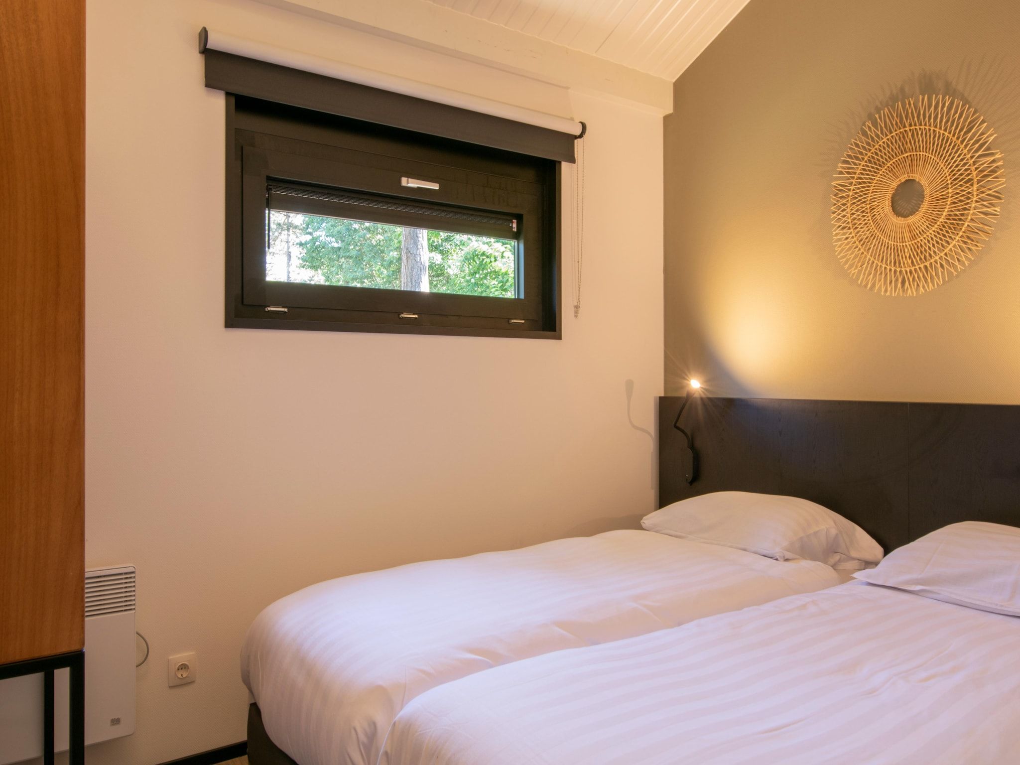 Een slaapkamer van Bospark 't Wolfsven 15 in Mierlo