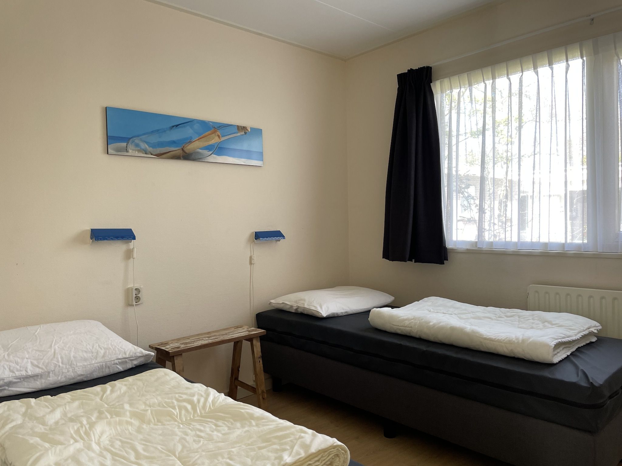 Een slaapkamer van Bungalowpark Campanula 1 in St. Maartenszee