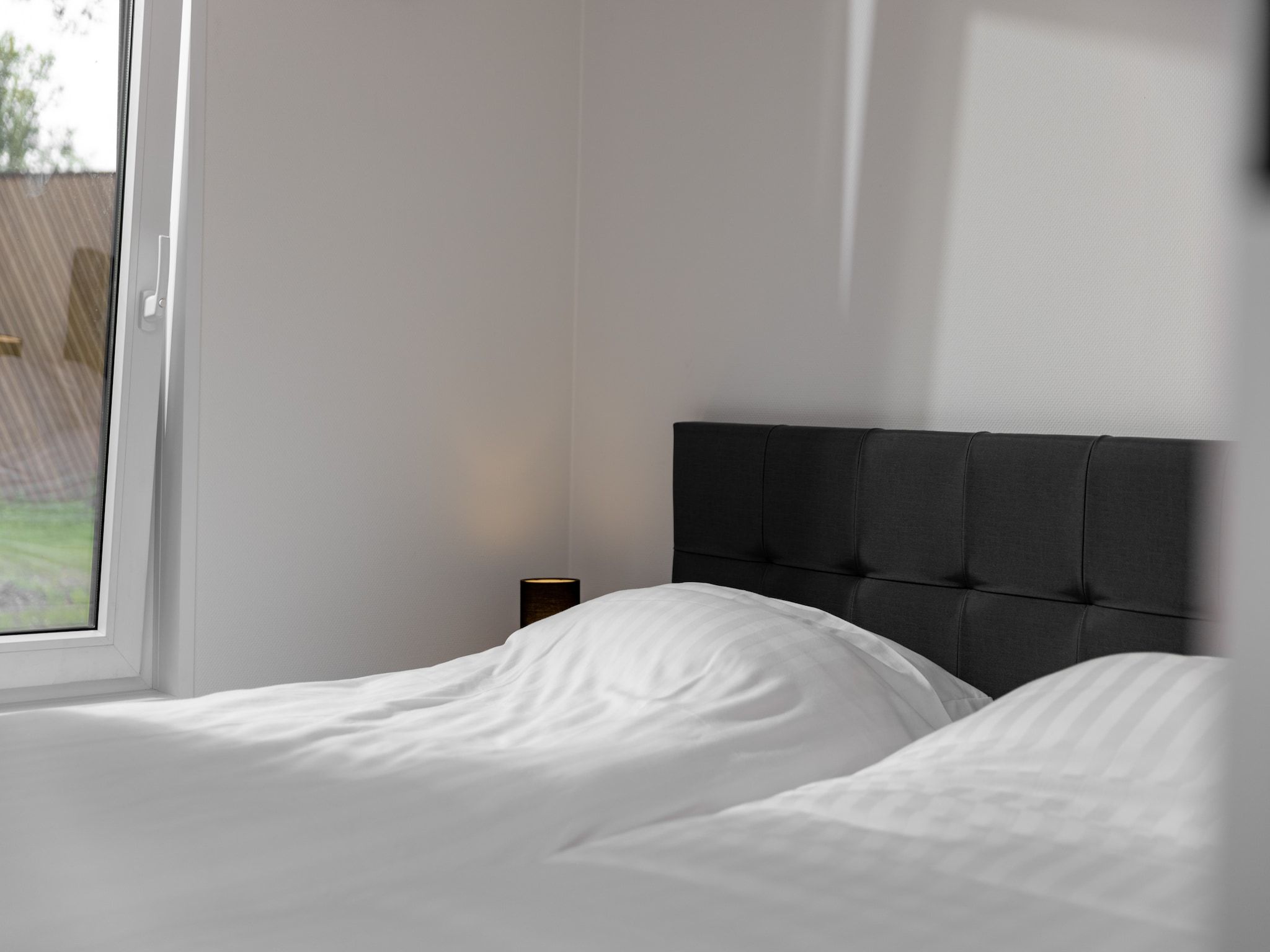 Een slaapkamer van Vakantiepark Schaijk 5 in Schaijk