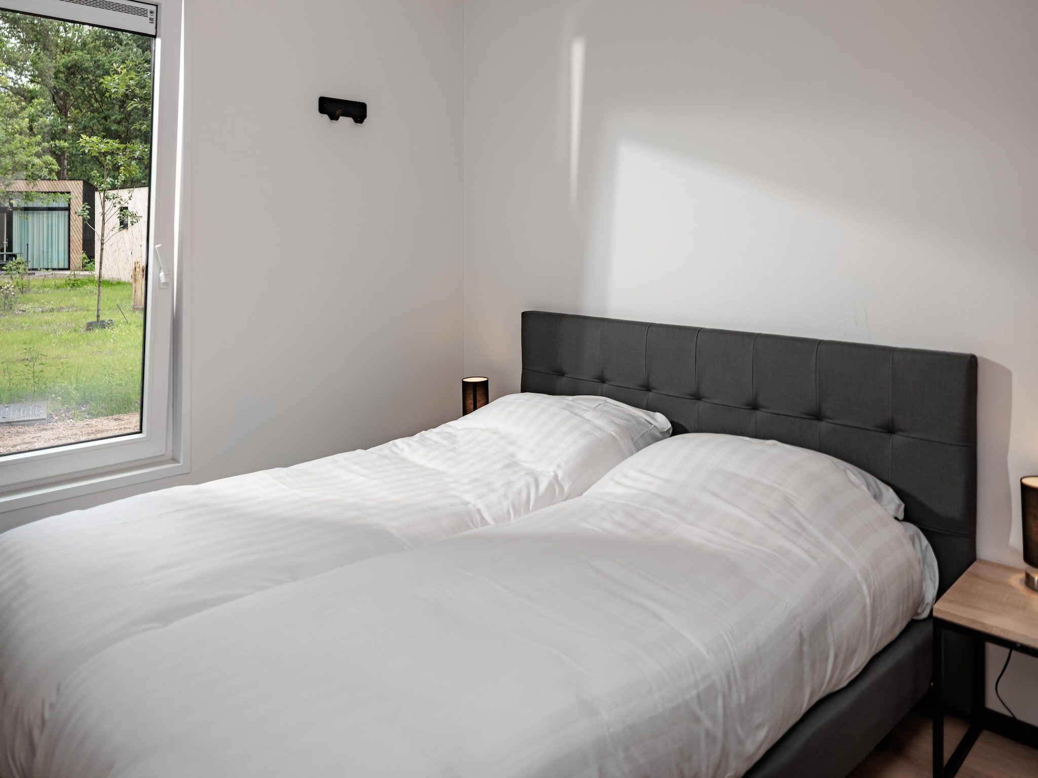 Een slaapkamer van Vakantiepark Schaijk 6 in Schaijk