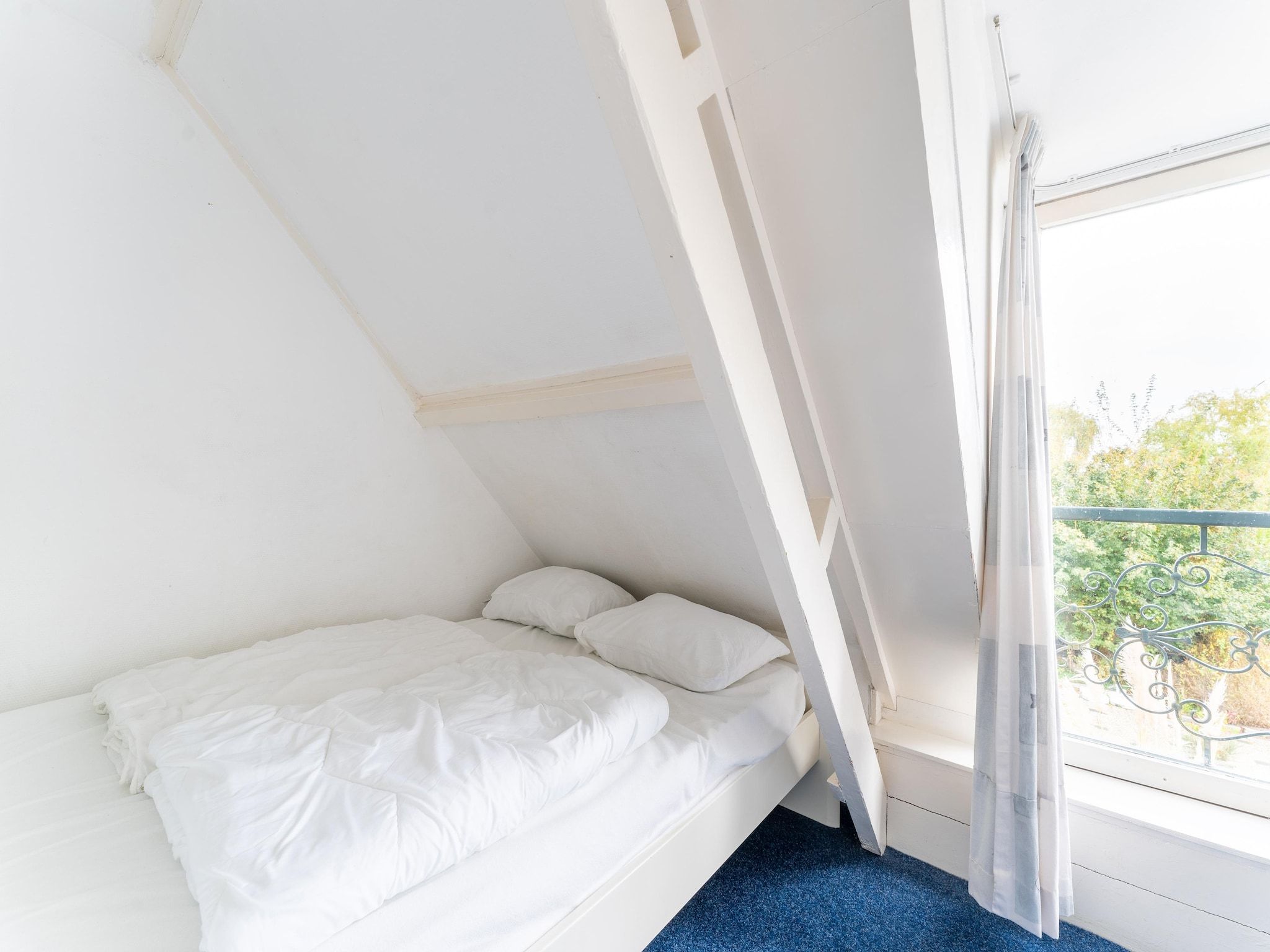 Een slaapkamer van Vakantiehuis Heeg in Heeg