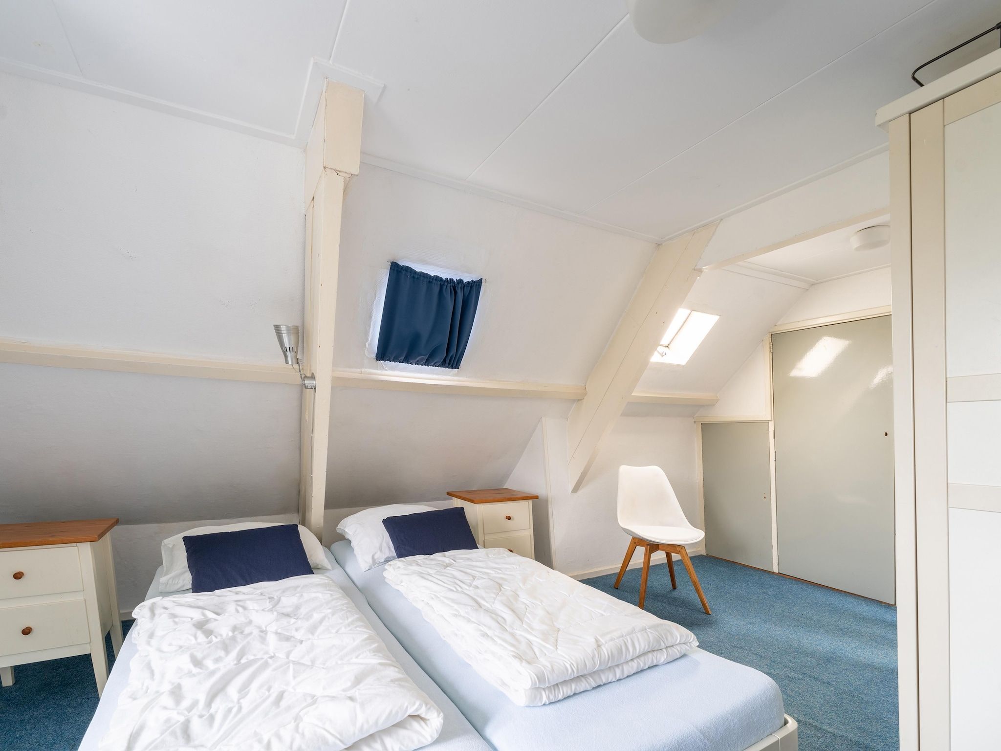 Een slaapkamer van Vakantiehuis Heeg in Heeg