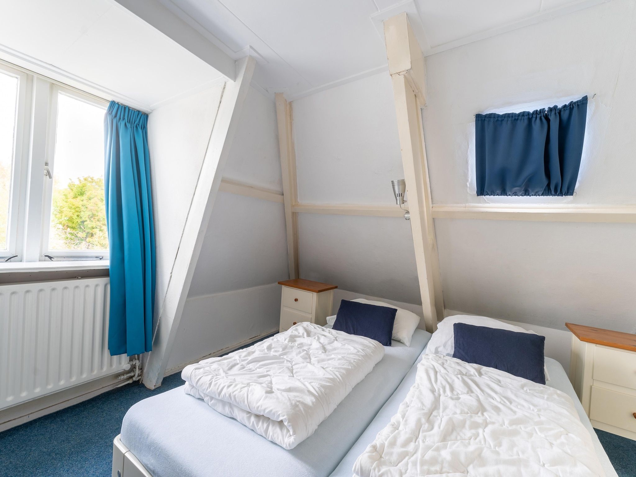 Een slaapkamer van Vakantiehuis Heeg in Heeg